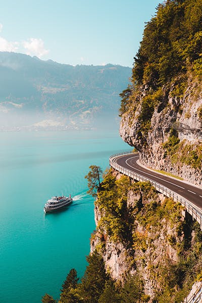 Picture of Lake Thun in Switzerland beside a road on the cliff