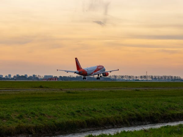 Easyjet aircraft ascending during sunset