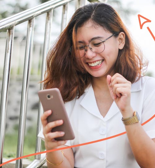 Woman laughing at phone