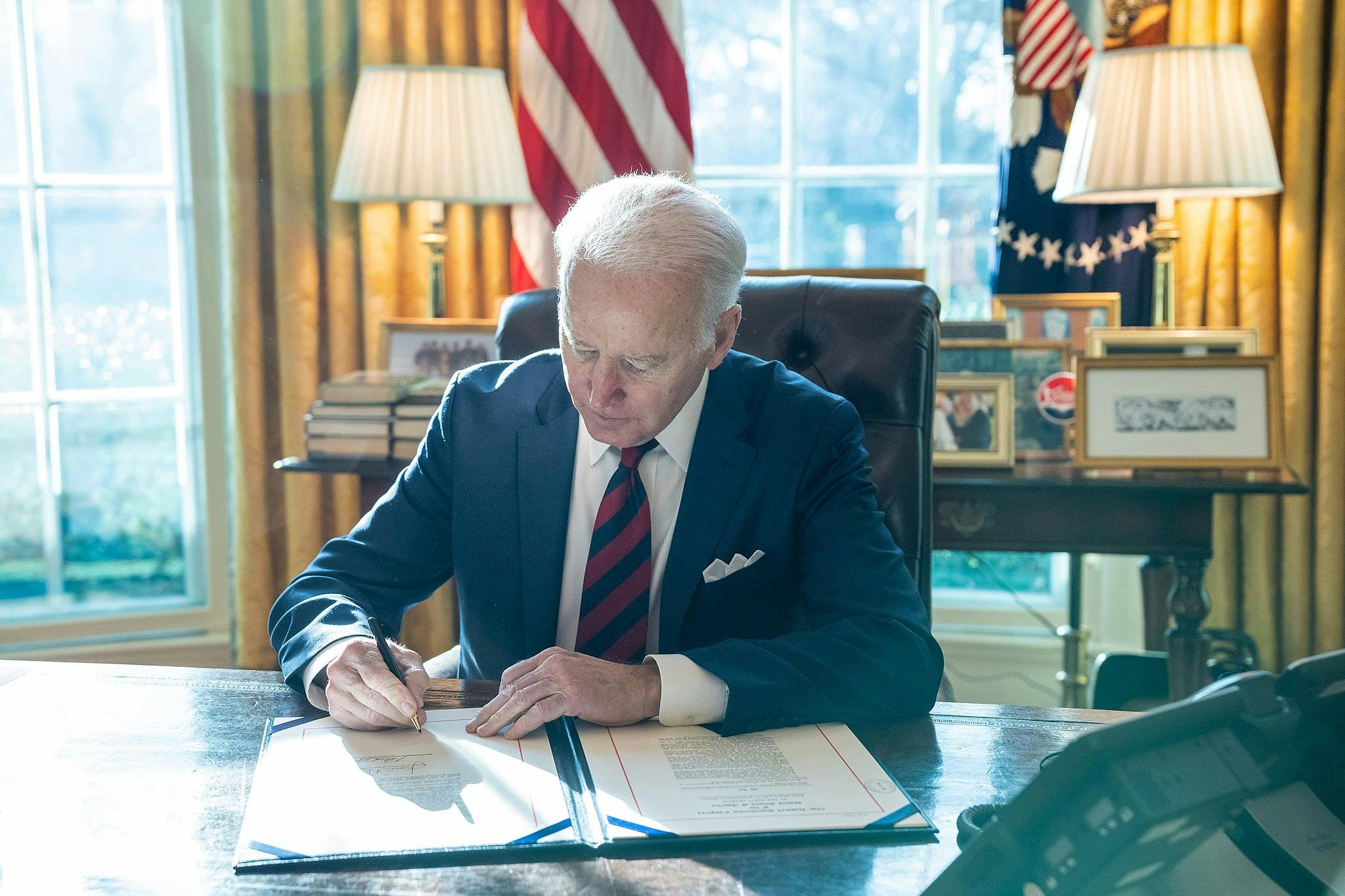President Joe Biden signs H.R. 6256, an act 