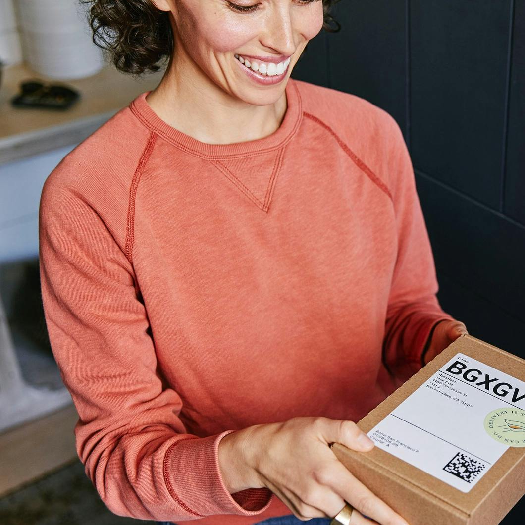 Photo of an Alto Heart Health customer receiving her medication