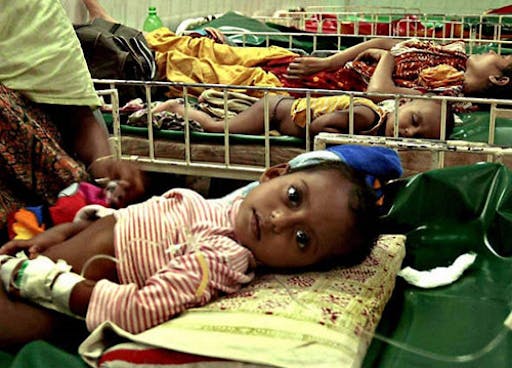 Children lying in hospital beds