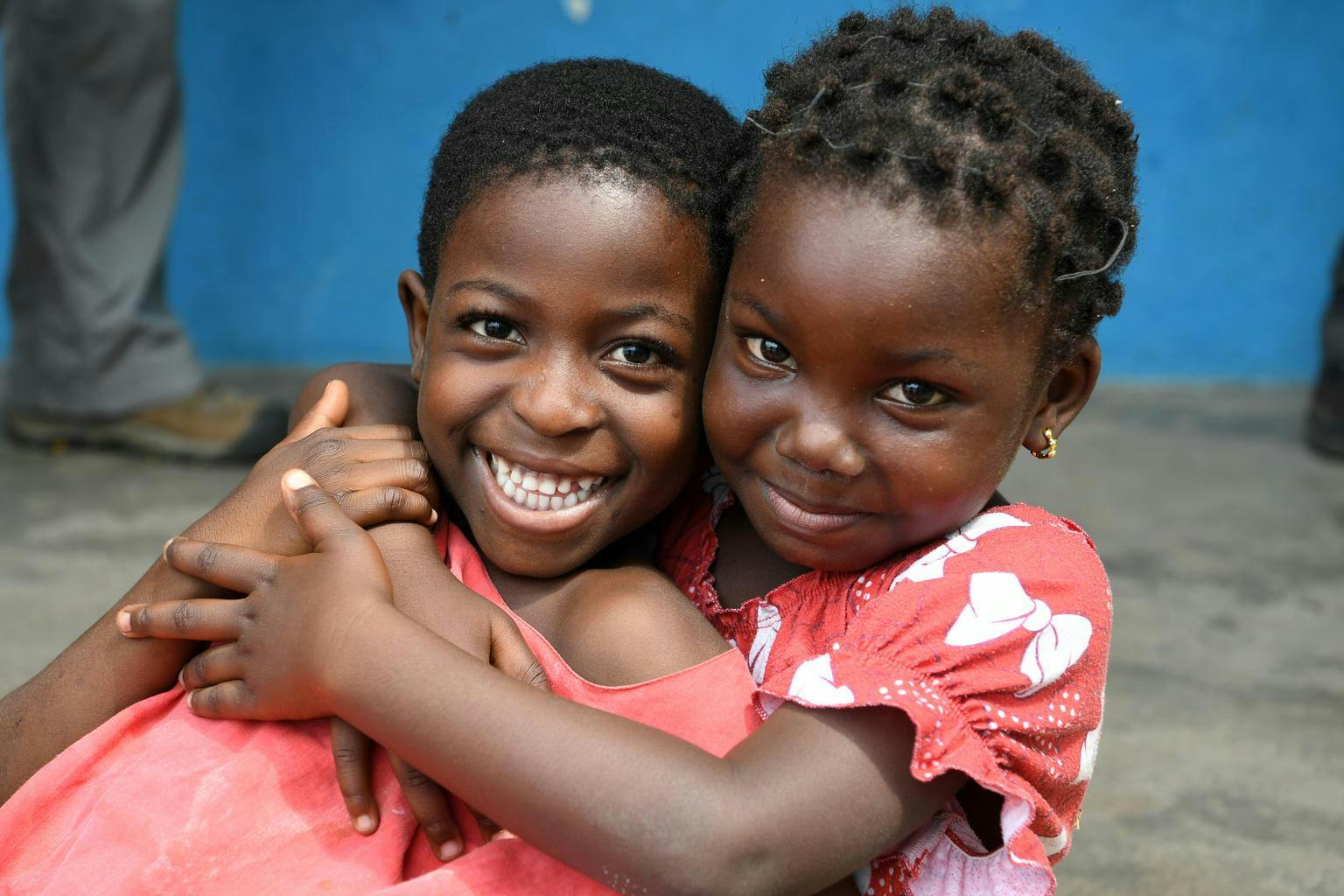 Children smiling and hugging