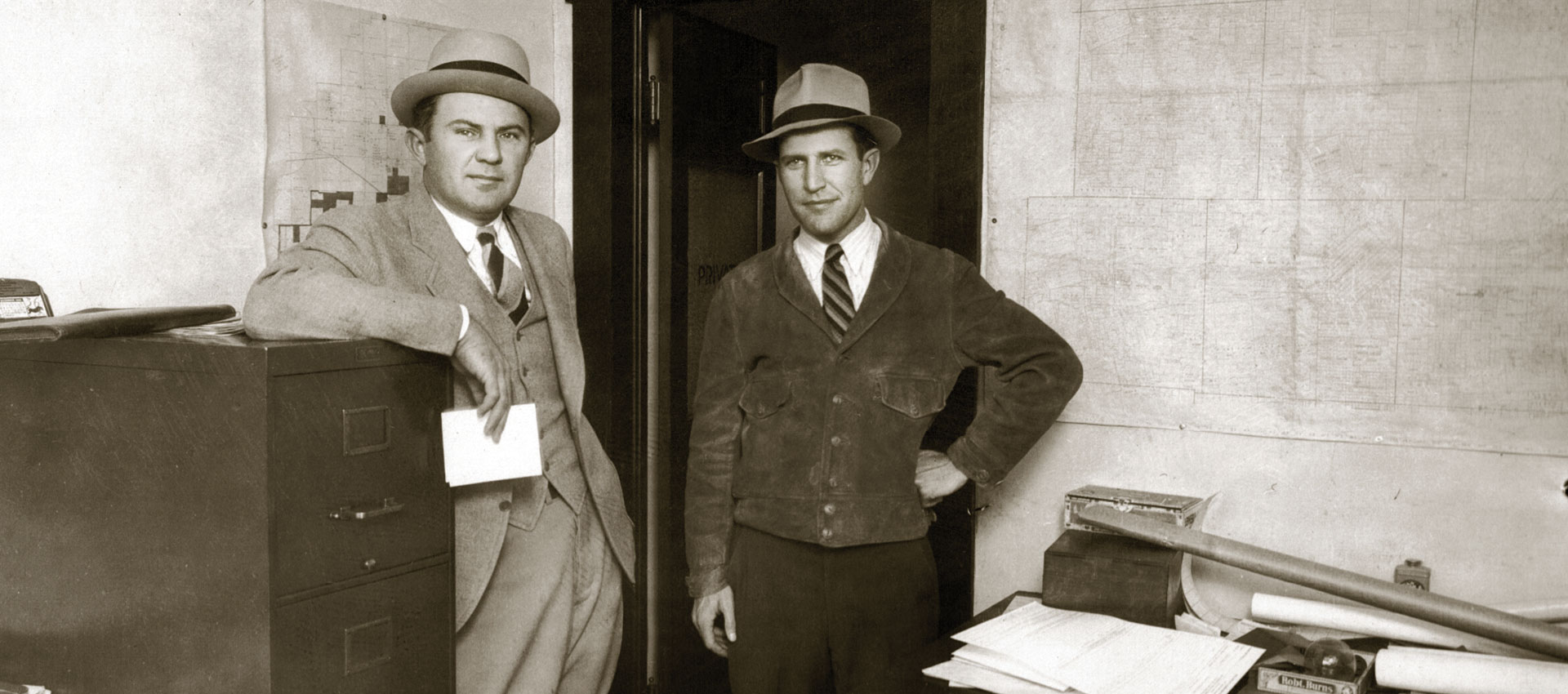 H.R. Stasney and A.V. Jones, Sr. in map room