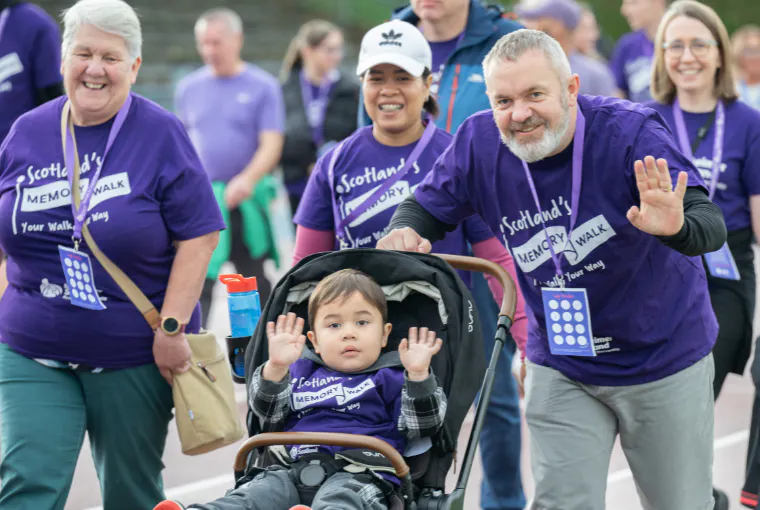 Family walking with pram for the memory walk