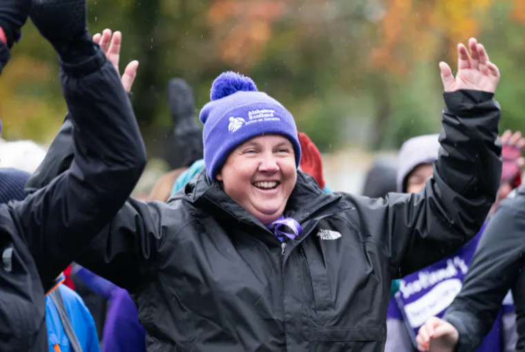 Man smiling during memory walk warm up