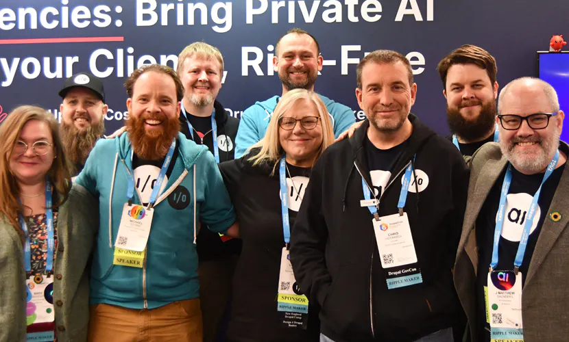 amazee.io team members gather at their DrupalCon conference exhibition booth, showcasing sovereign AI infrastructure and enterprise open source cloud hosting solutions.