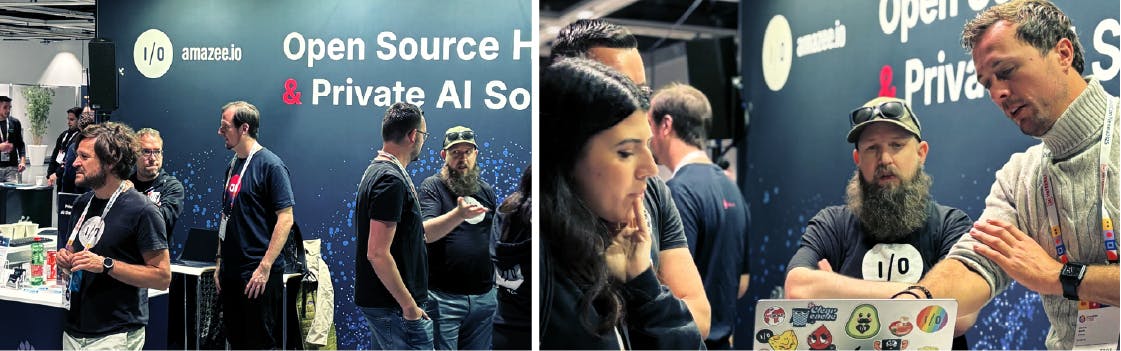 A side-by-side photo showing various people interacting at the amazee.io booth at a conference. The booth backdrop is dark blue and features the I/O and amazee.io logos, with white text that reads, "Open Source Hosting & Private AI Solutions."
Left Image: Several men are standing and talking around the booth.
Right Image: A closer-up photo shows three people—a man in a grey turtleneck, a man with a large beard and sunglasses perched on his cap, and a woman—engaged in a discussion over a laptop.