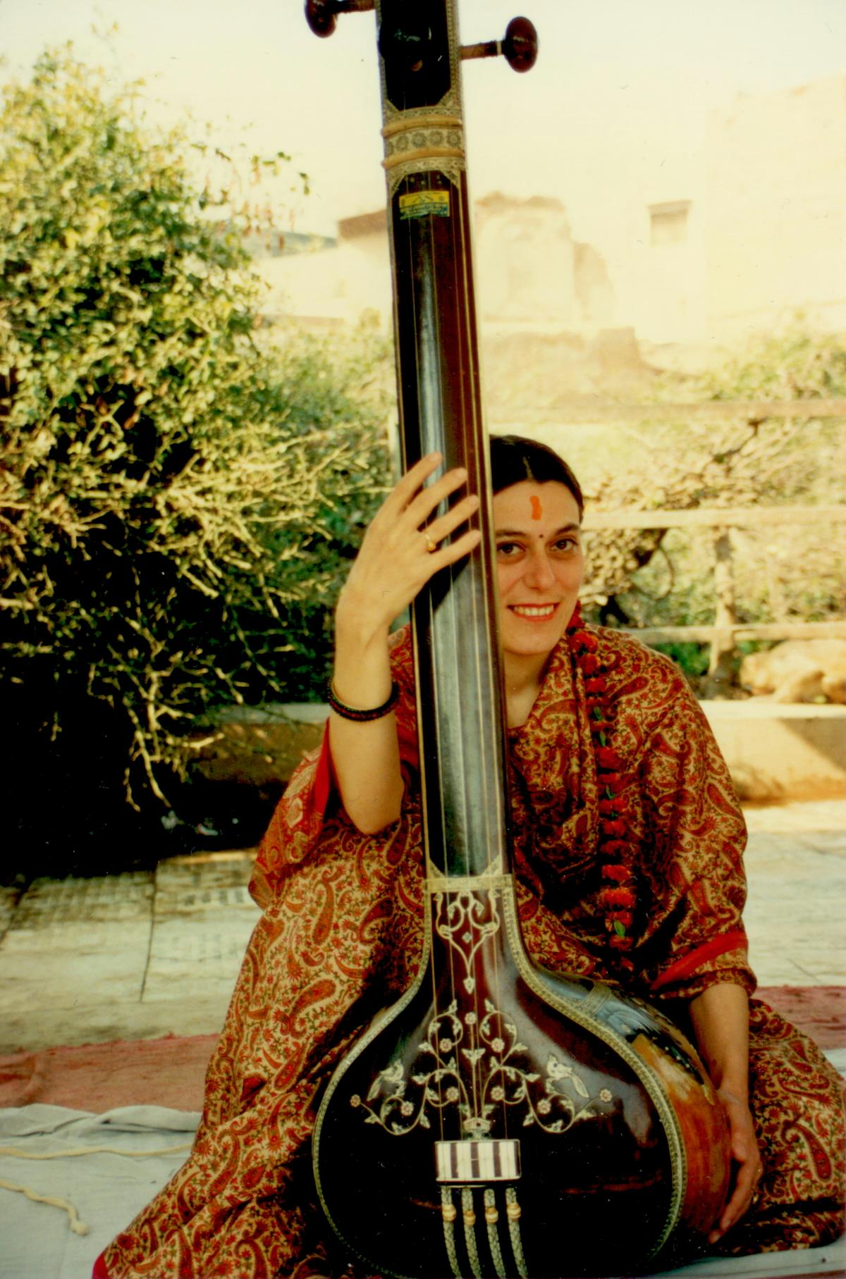 Amelia with a tambura