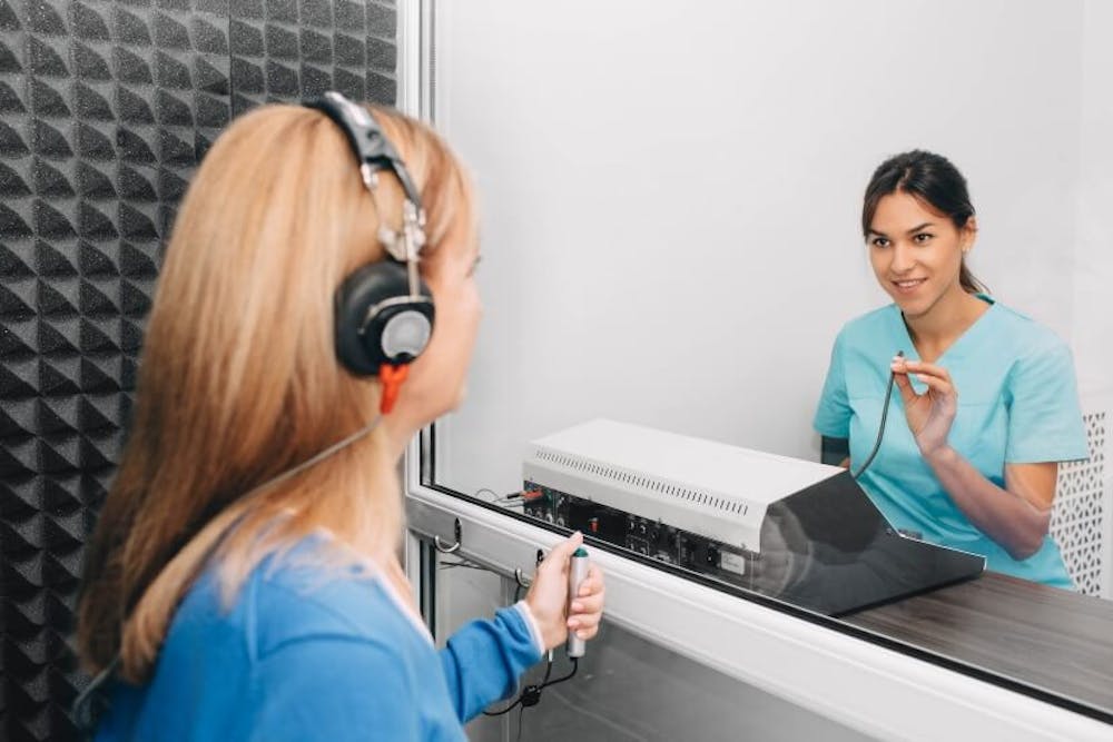 What are the signs and symptoms that indicate a need for a hearing test in Naples, FL?
