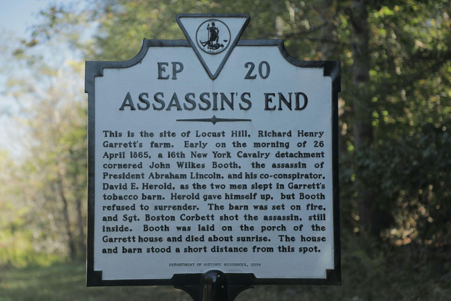 A sign with the title 'Assassin's End'