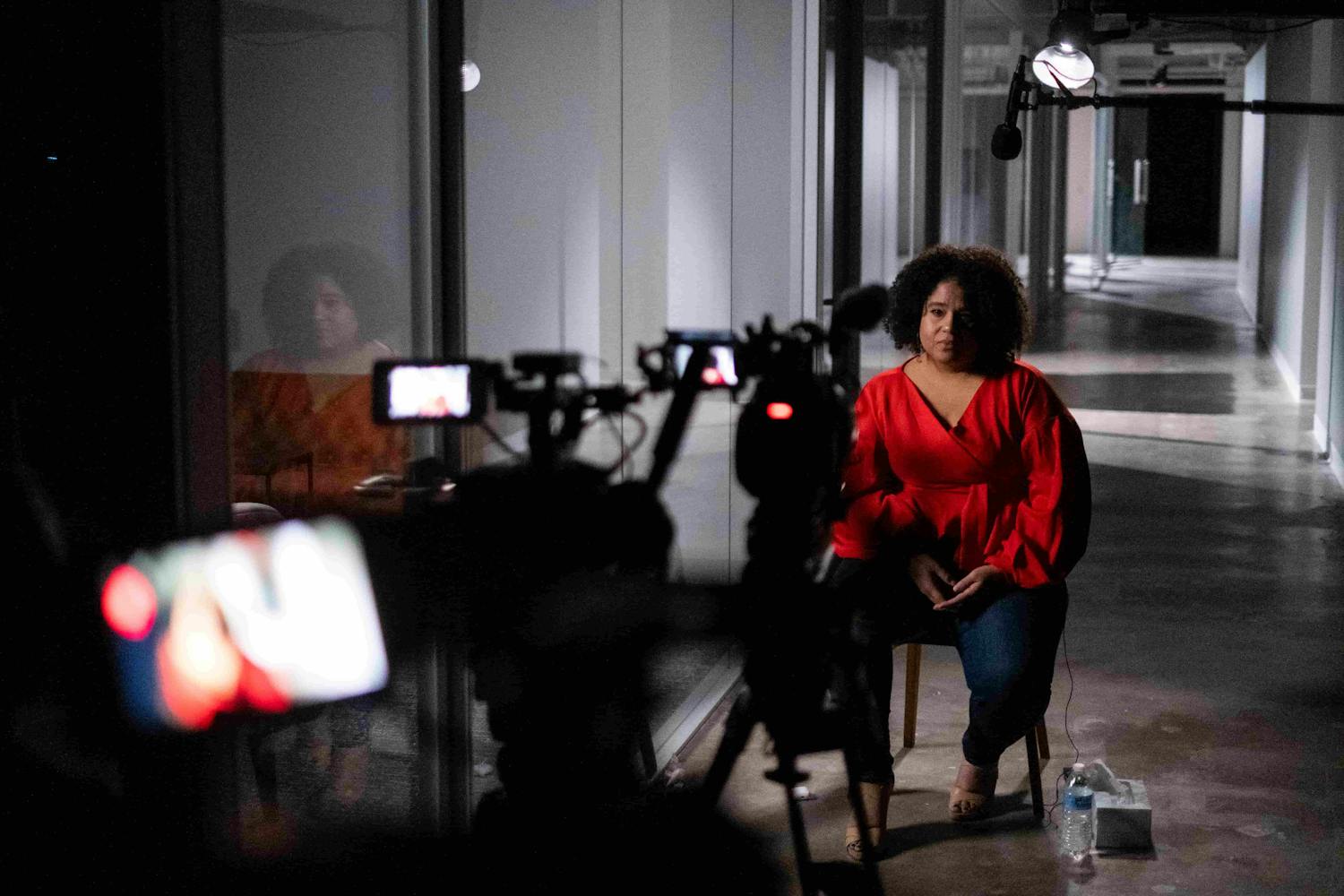 Behind the scenes shot of woman being interviewed