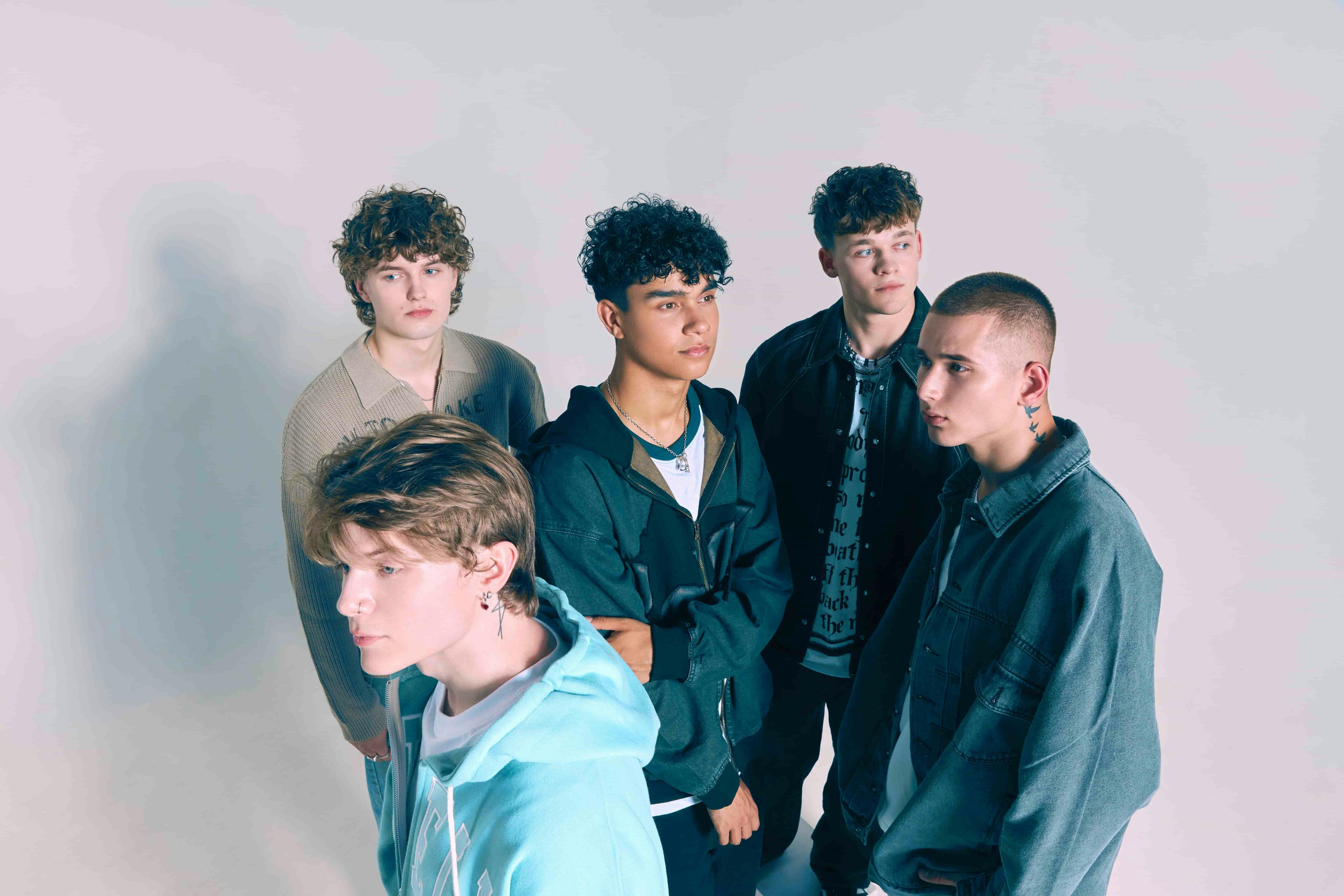 Shot from above of boyband posing for camera