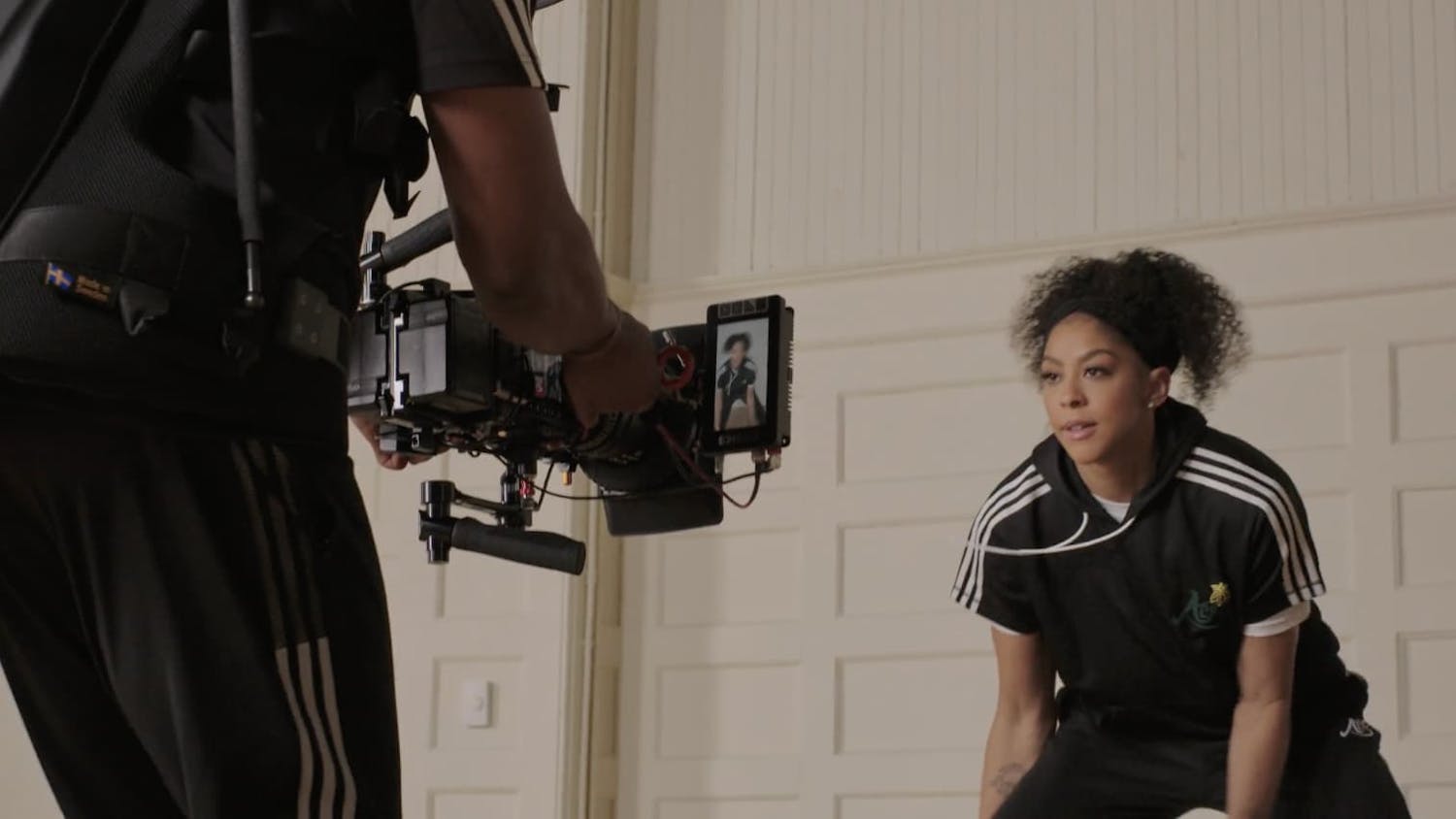 Woman in a sports pose in front of camera