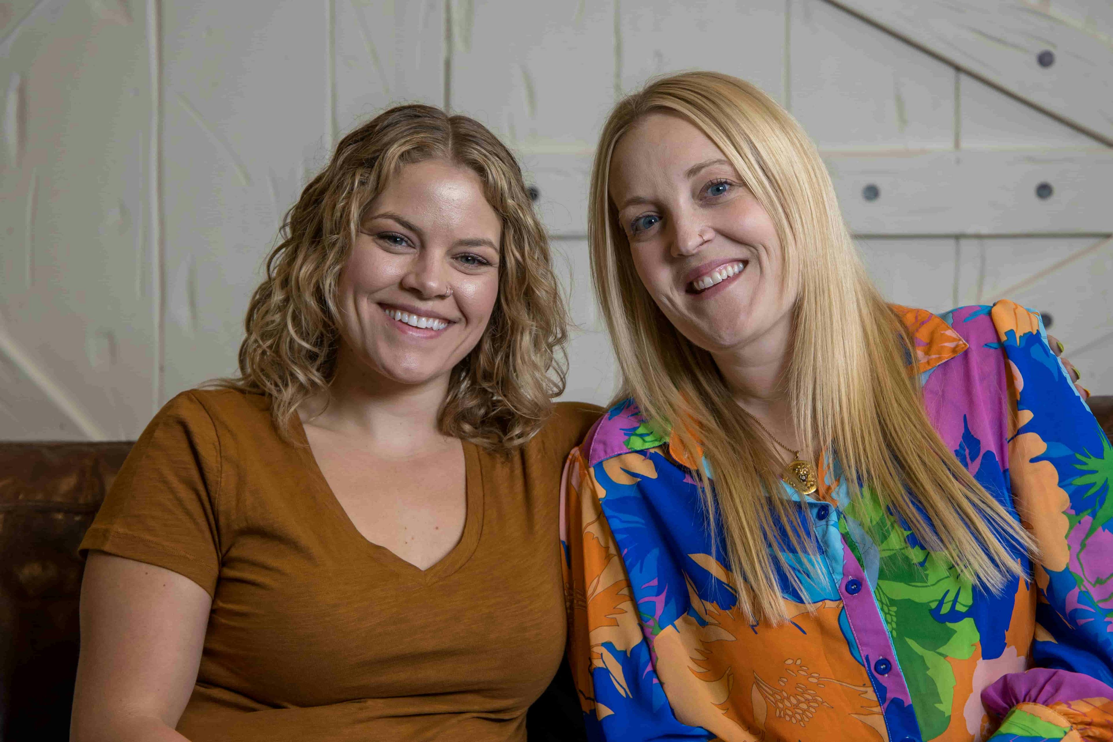 Two women smiling at camera