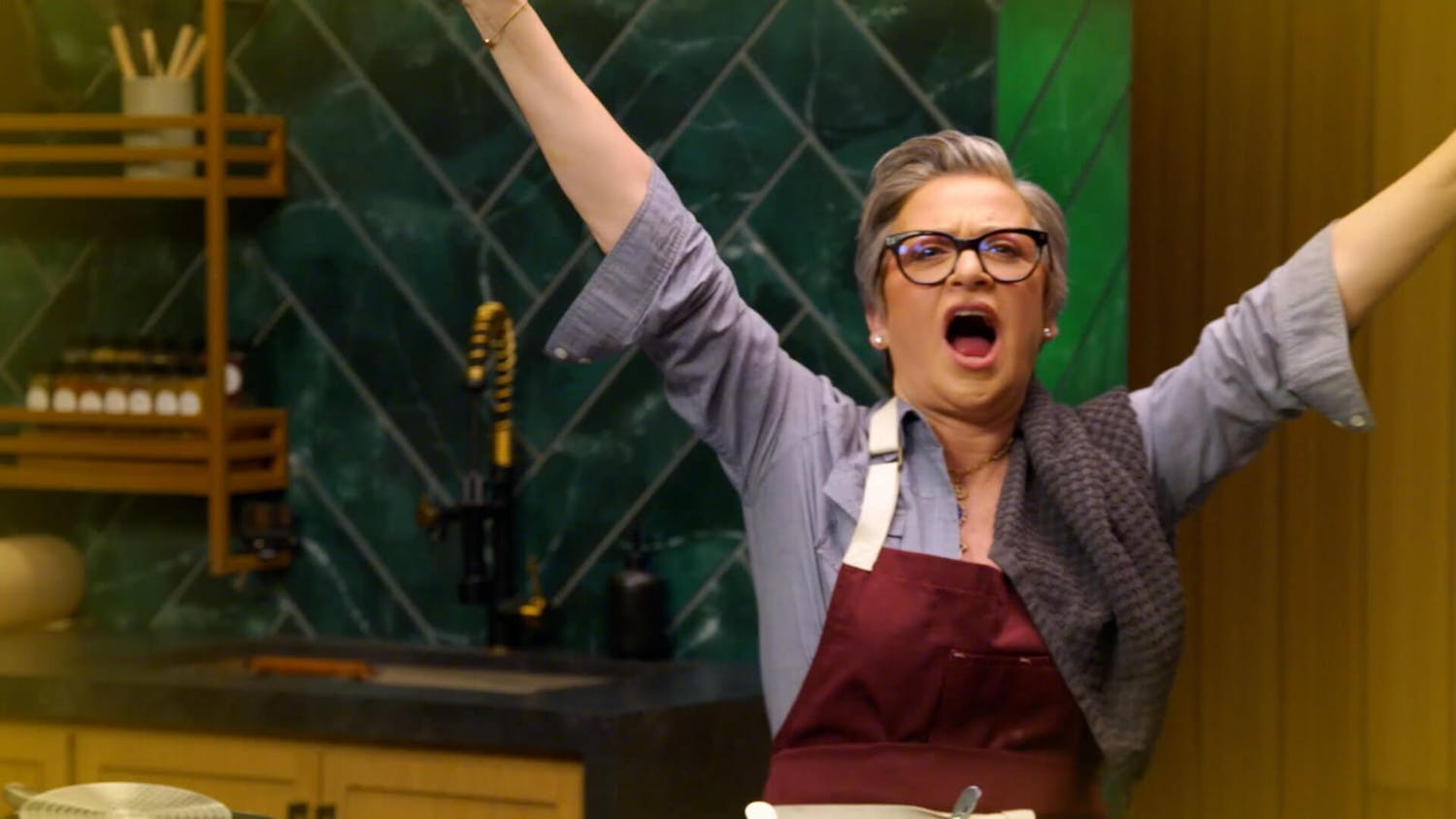 Woman in apron cheering