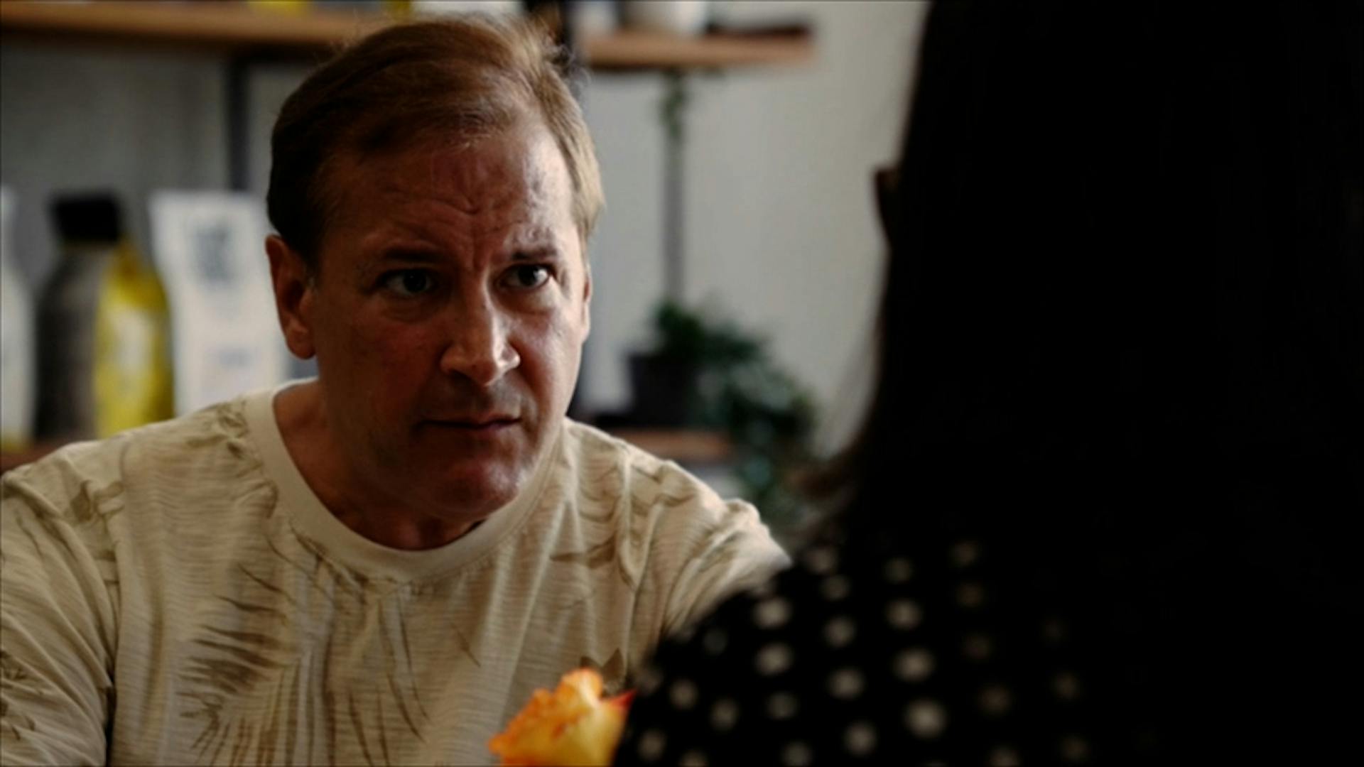 Man talking to interviewer