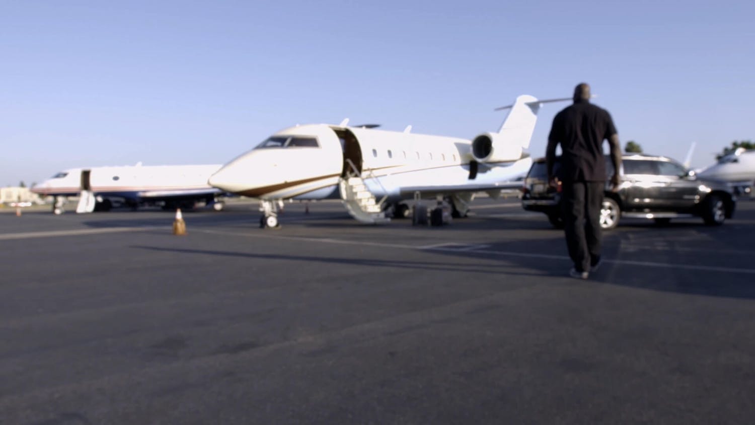 Man walking towards a jet