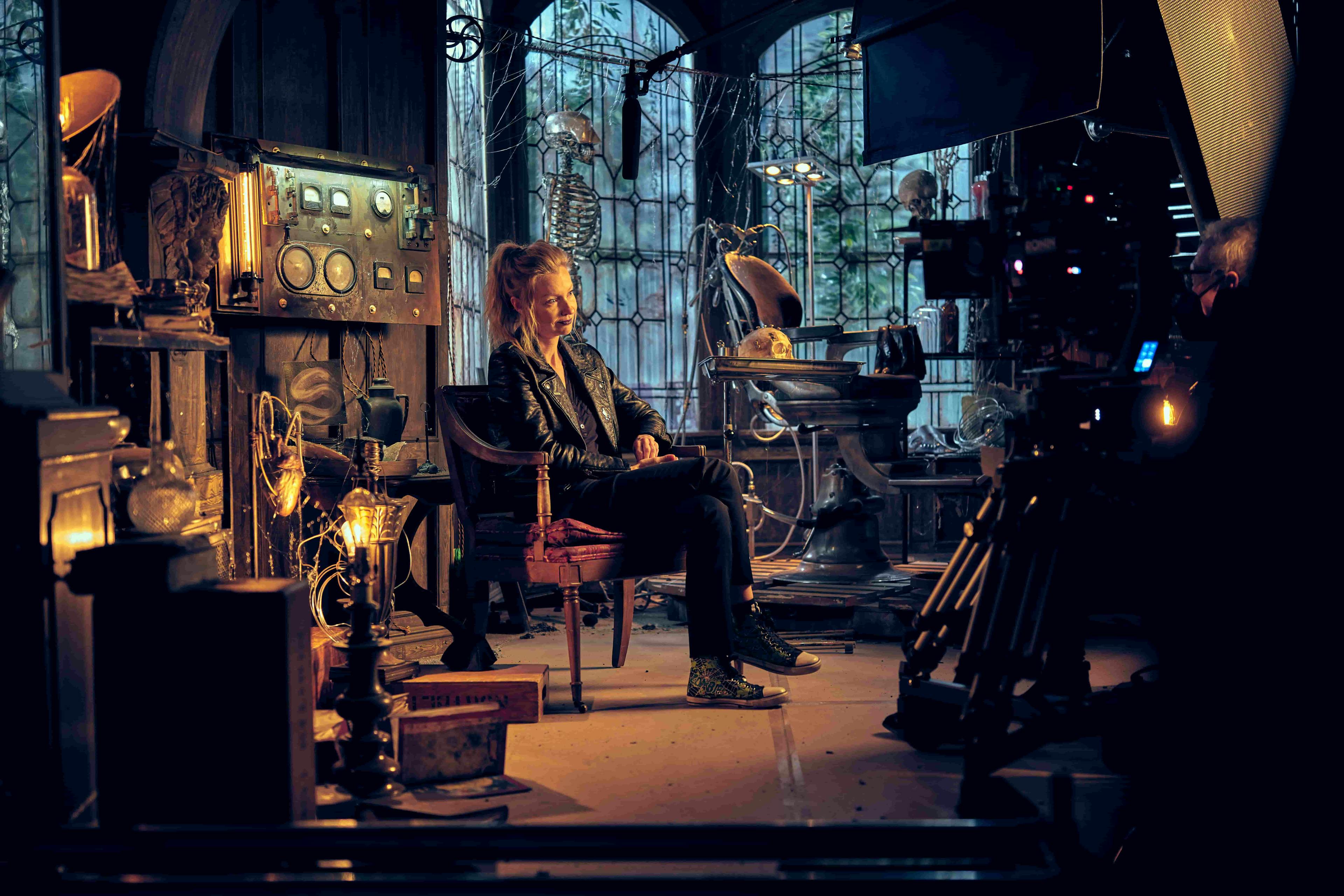 Behind the scenes shot of woman being interviewed