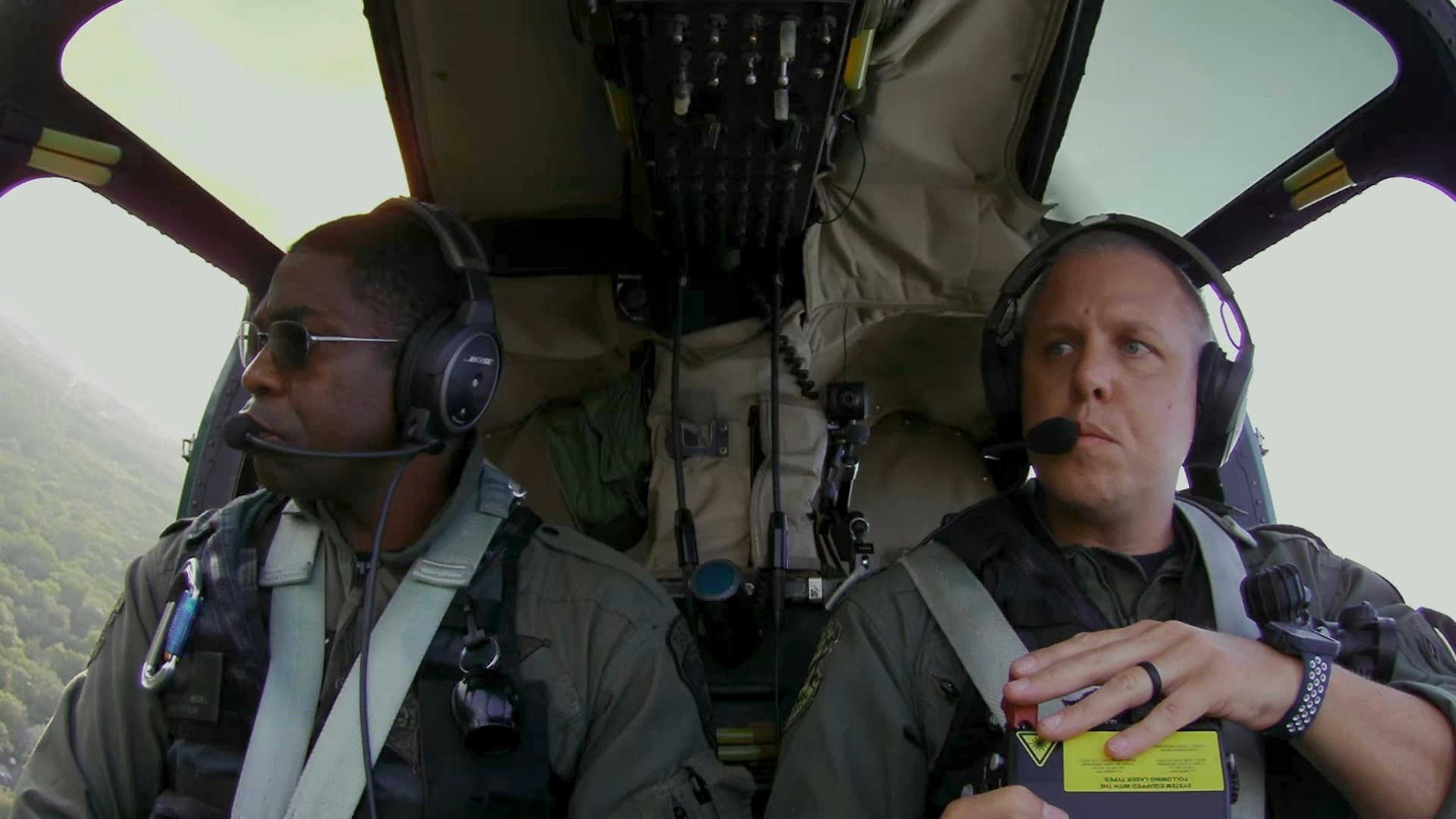 Two men in helicopter