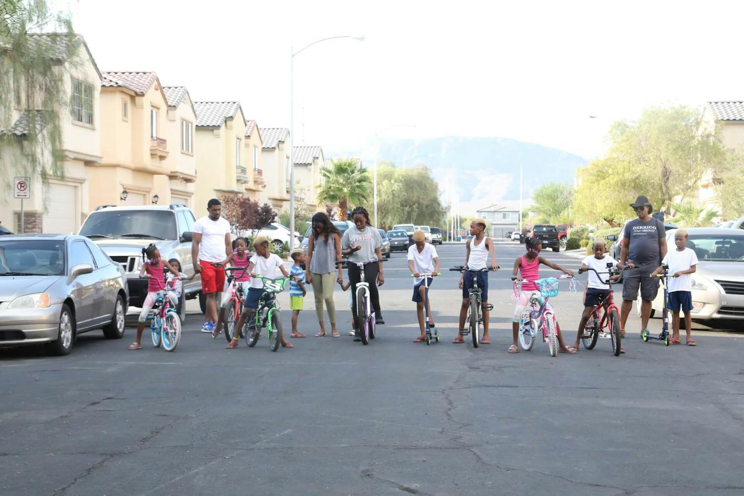 Row of family on bikes