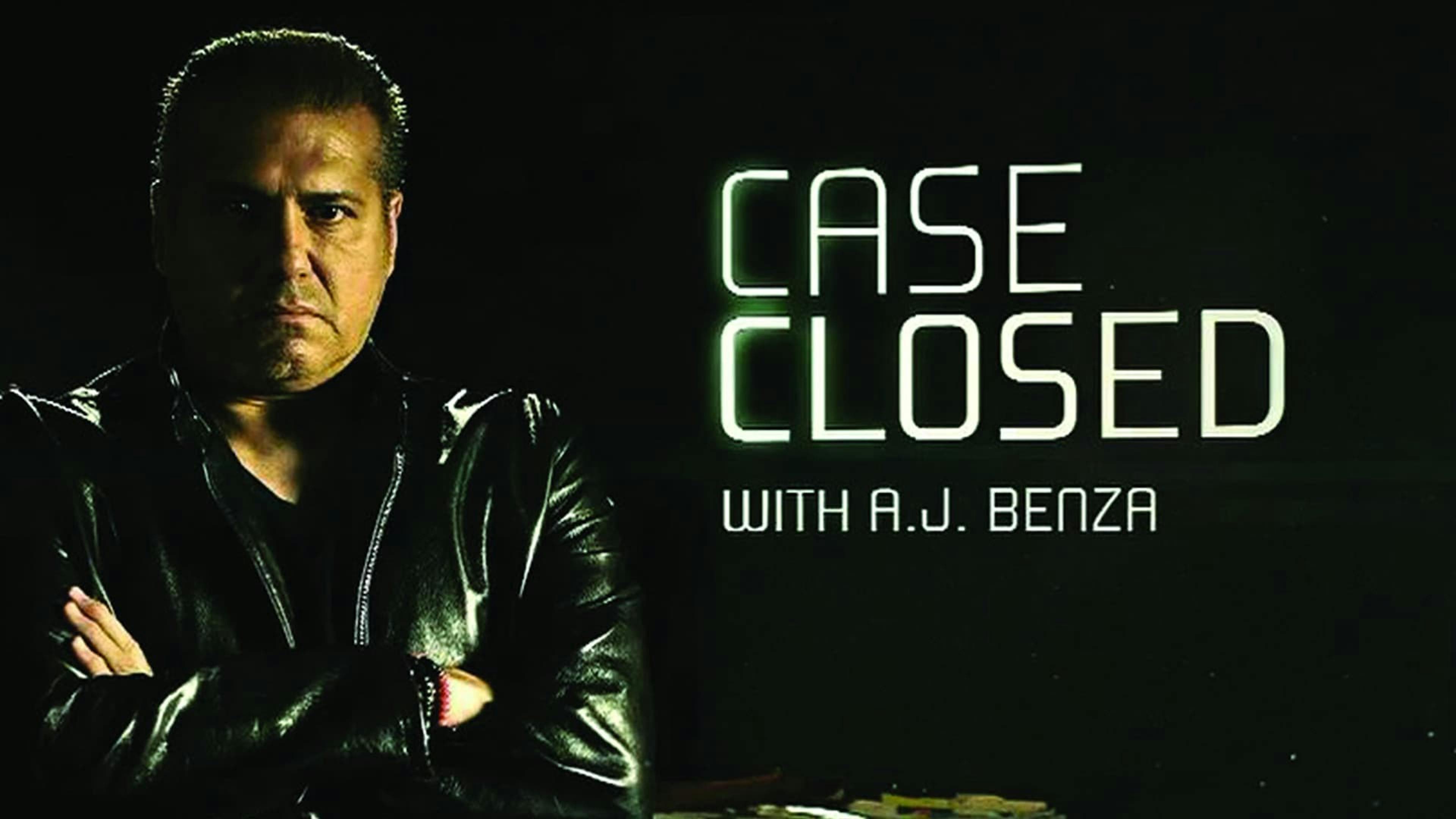 Man with arms crossed looking at camera