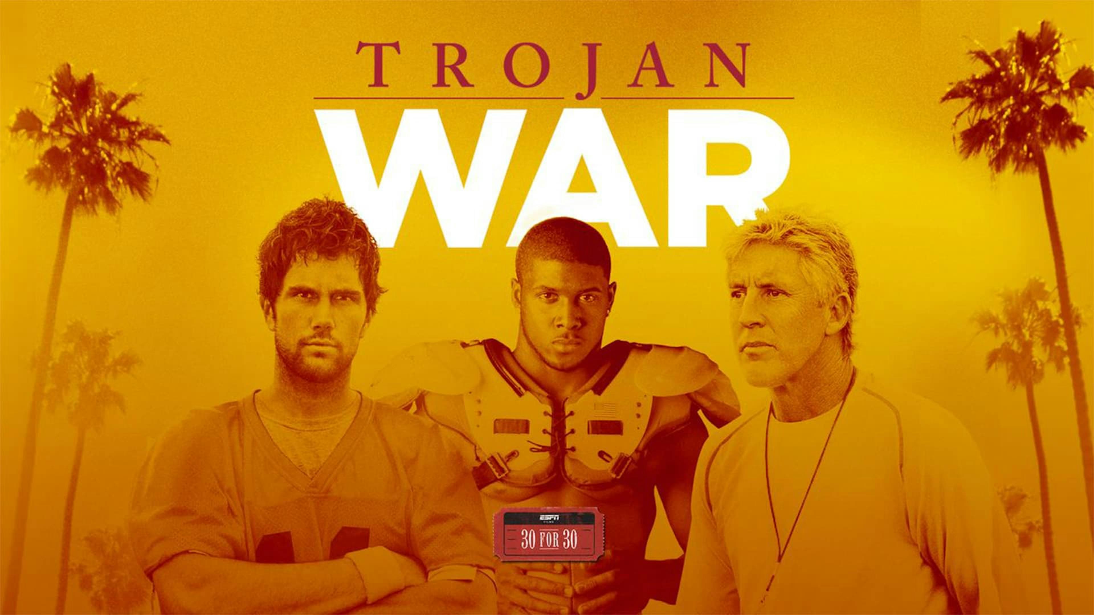 3 men posing for camera with palm trees in the background