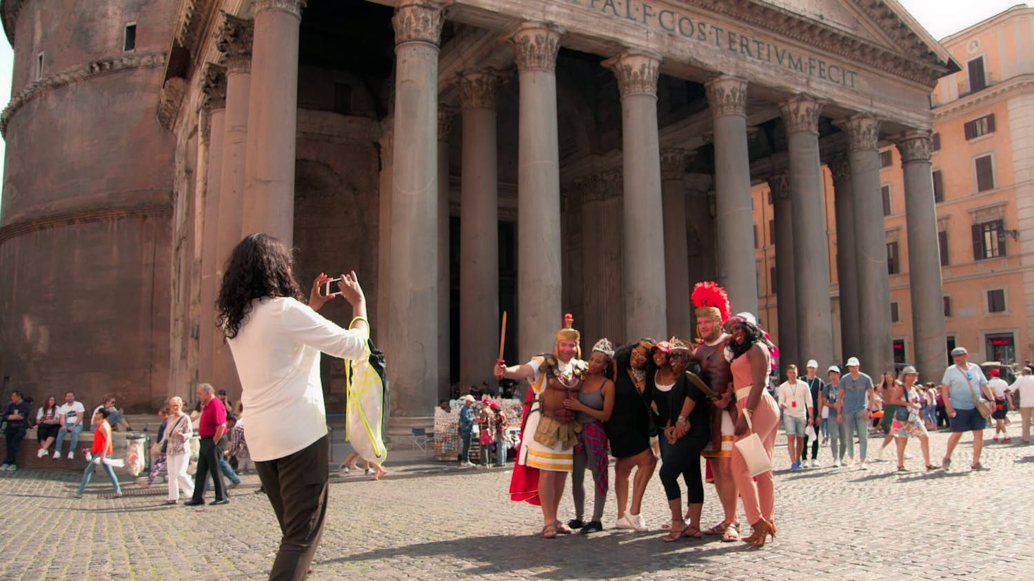 Five woman getting their photo taken in Rome