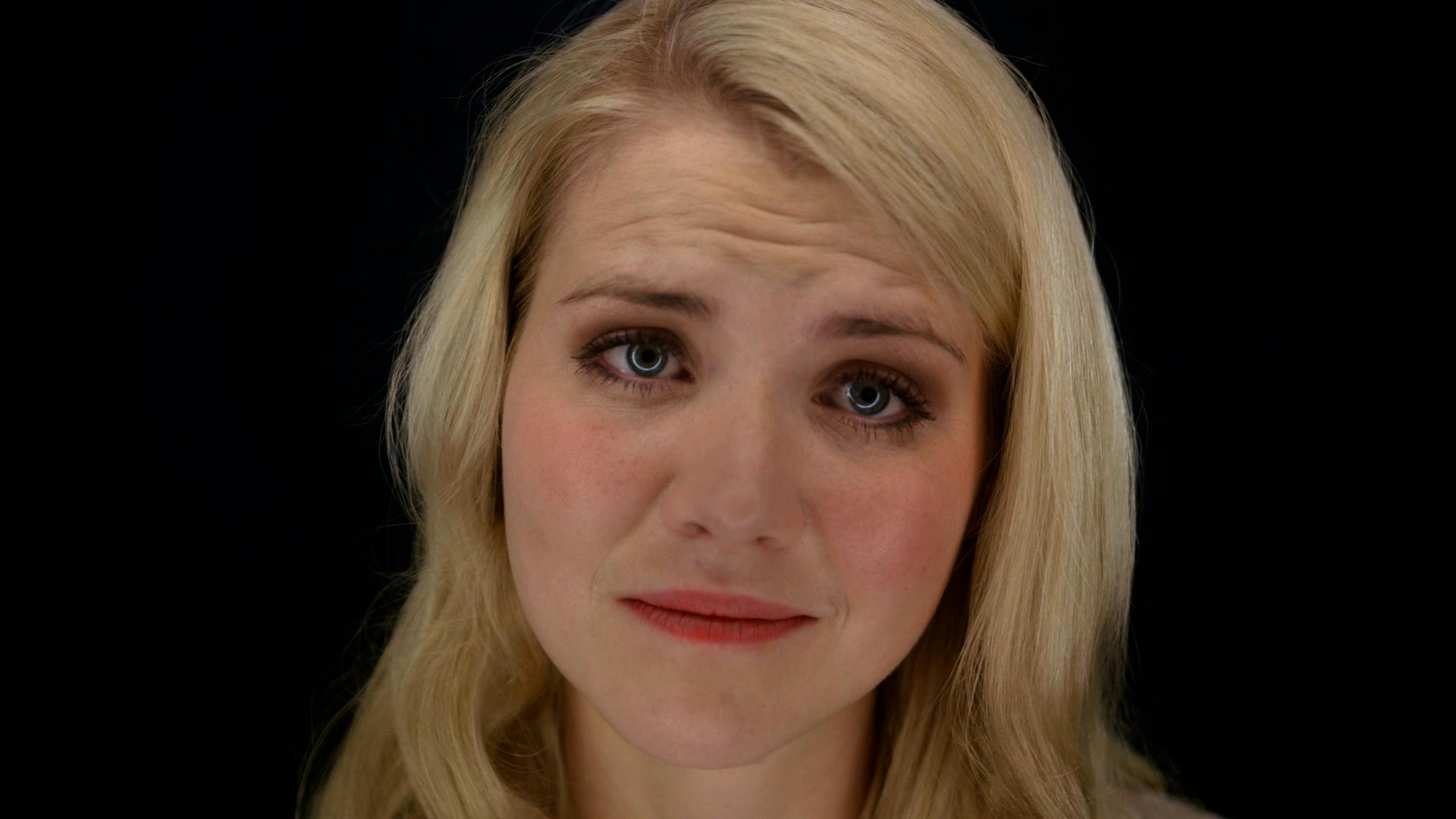 Girl crying looking into camera