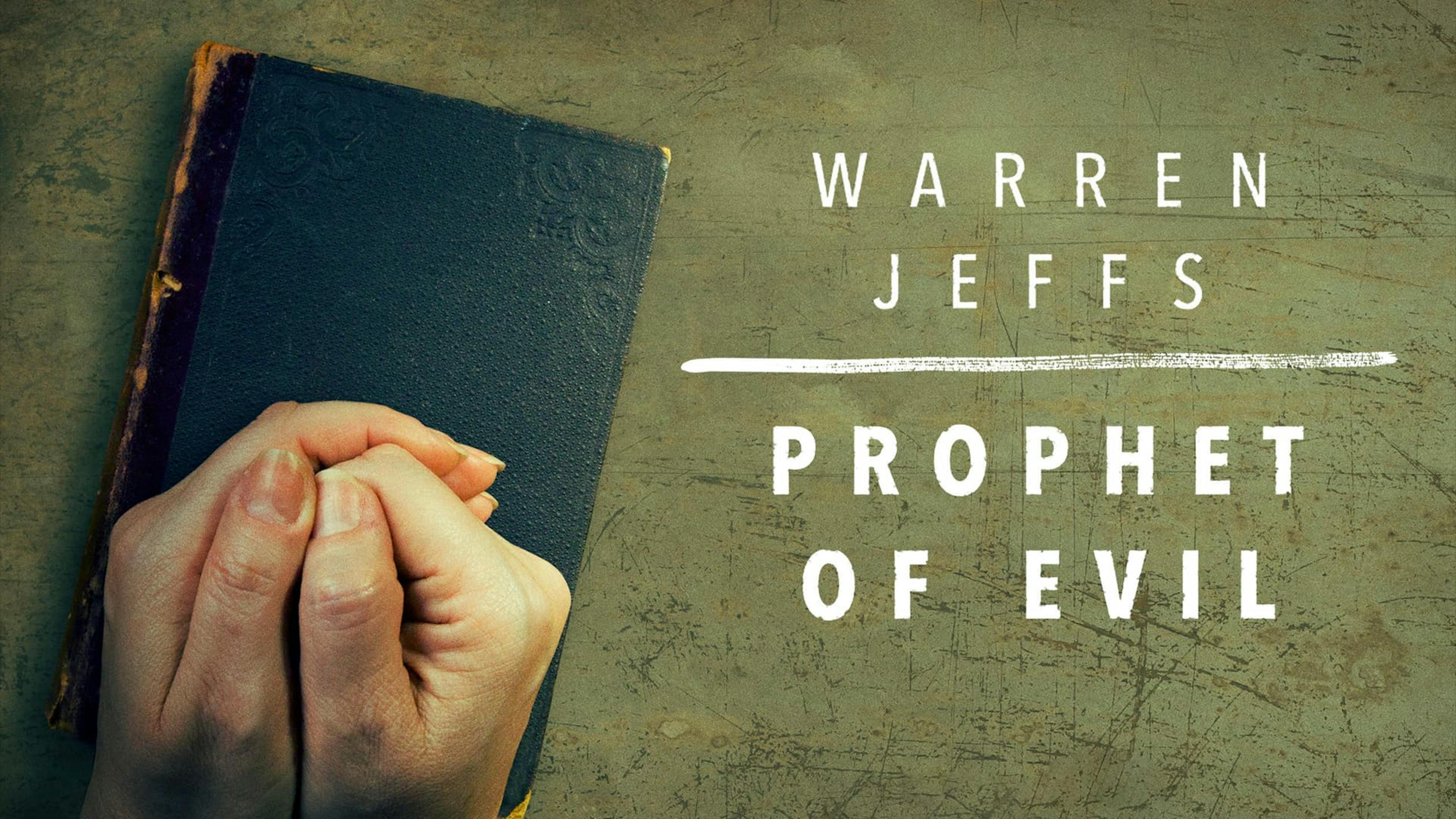 Arms crossed over book