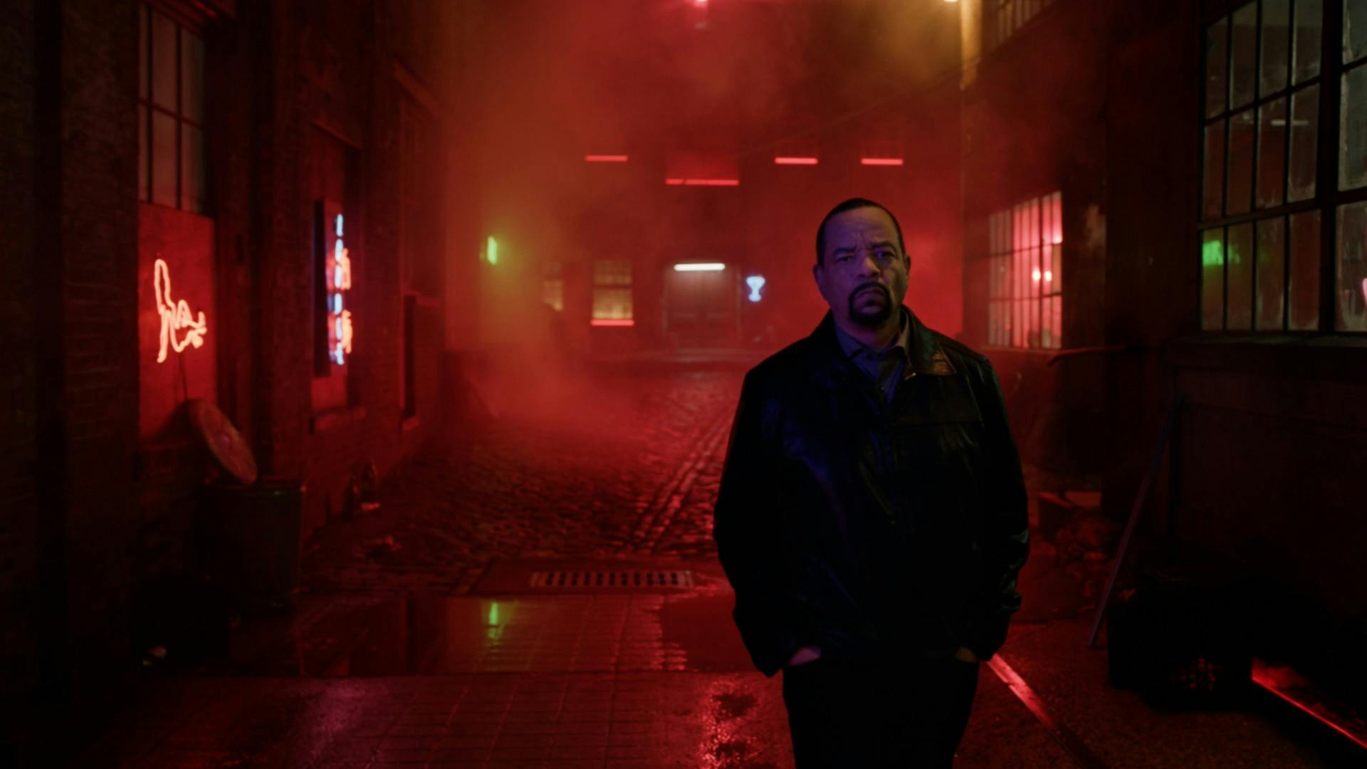 Man stood in poorly lit room