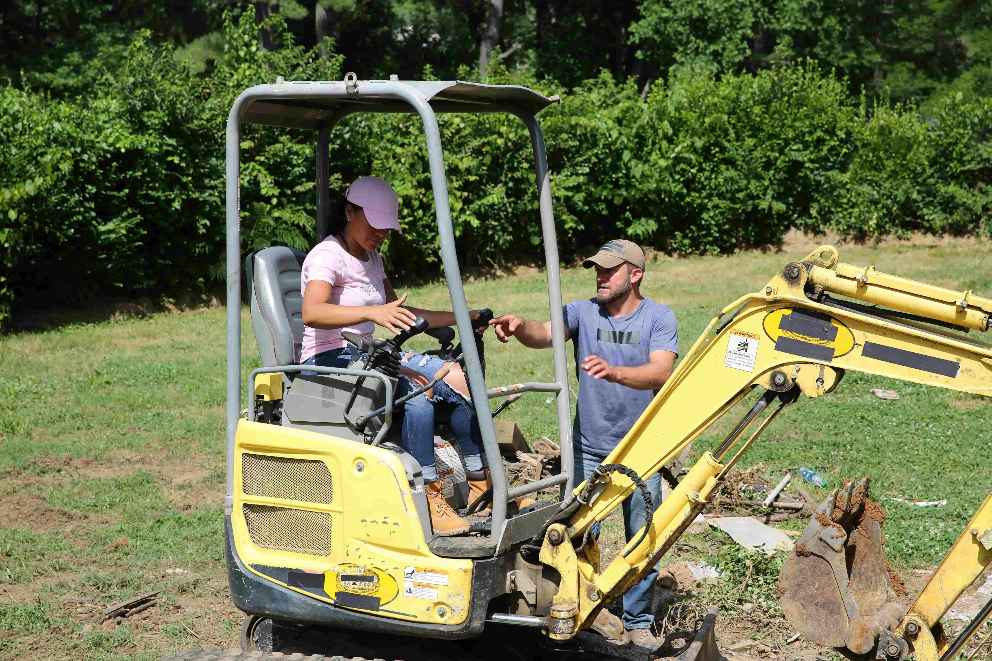 Woman sat on digger