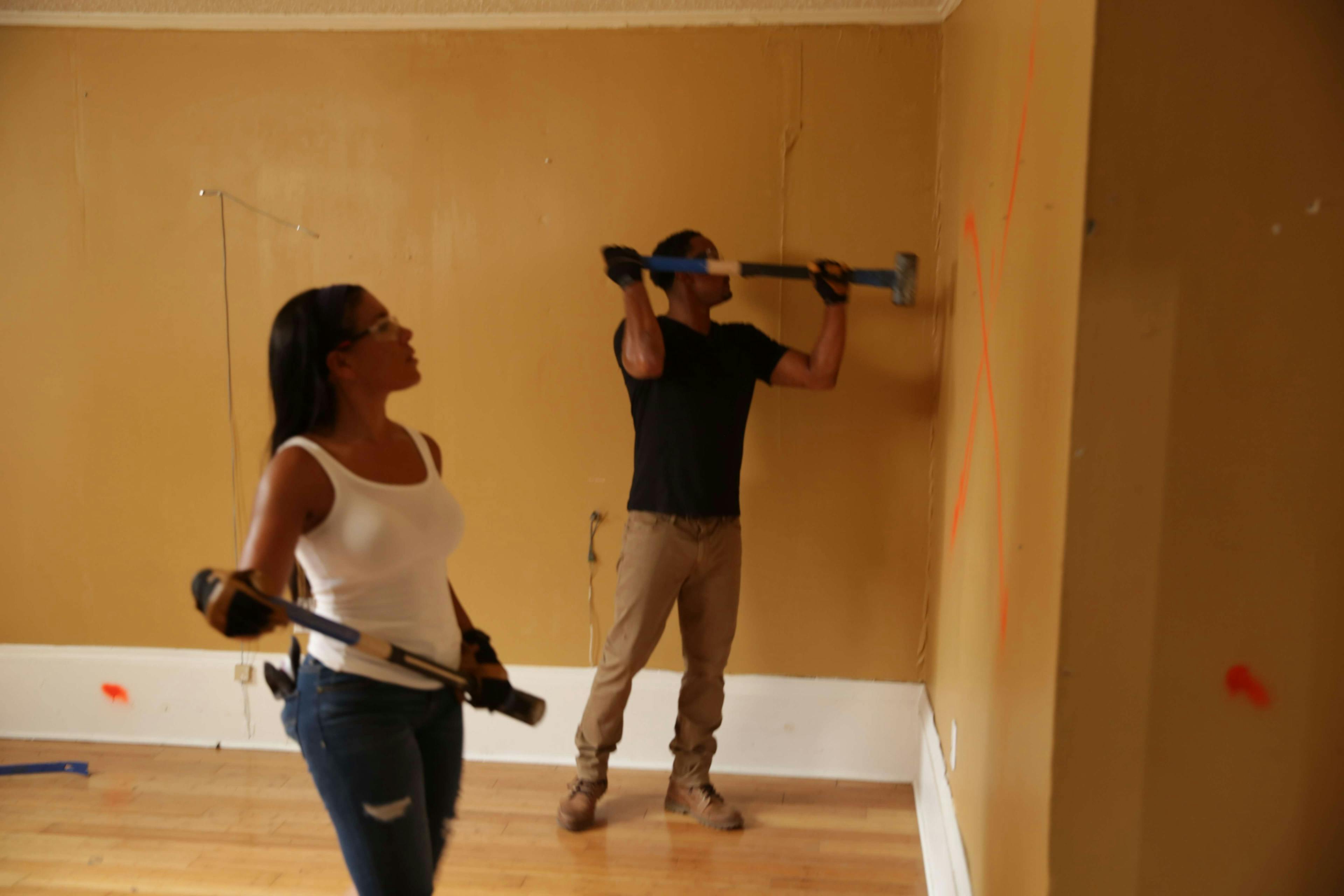 Couple decorating walls
