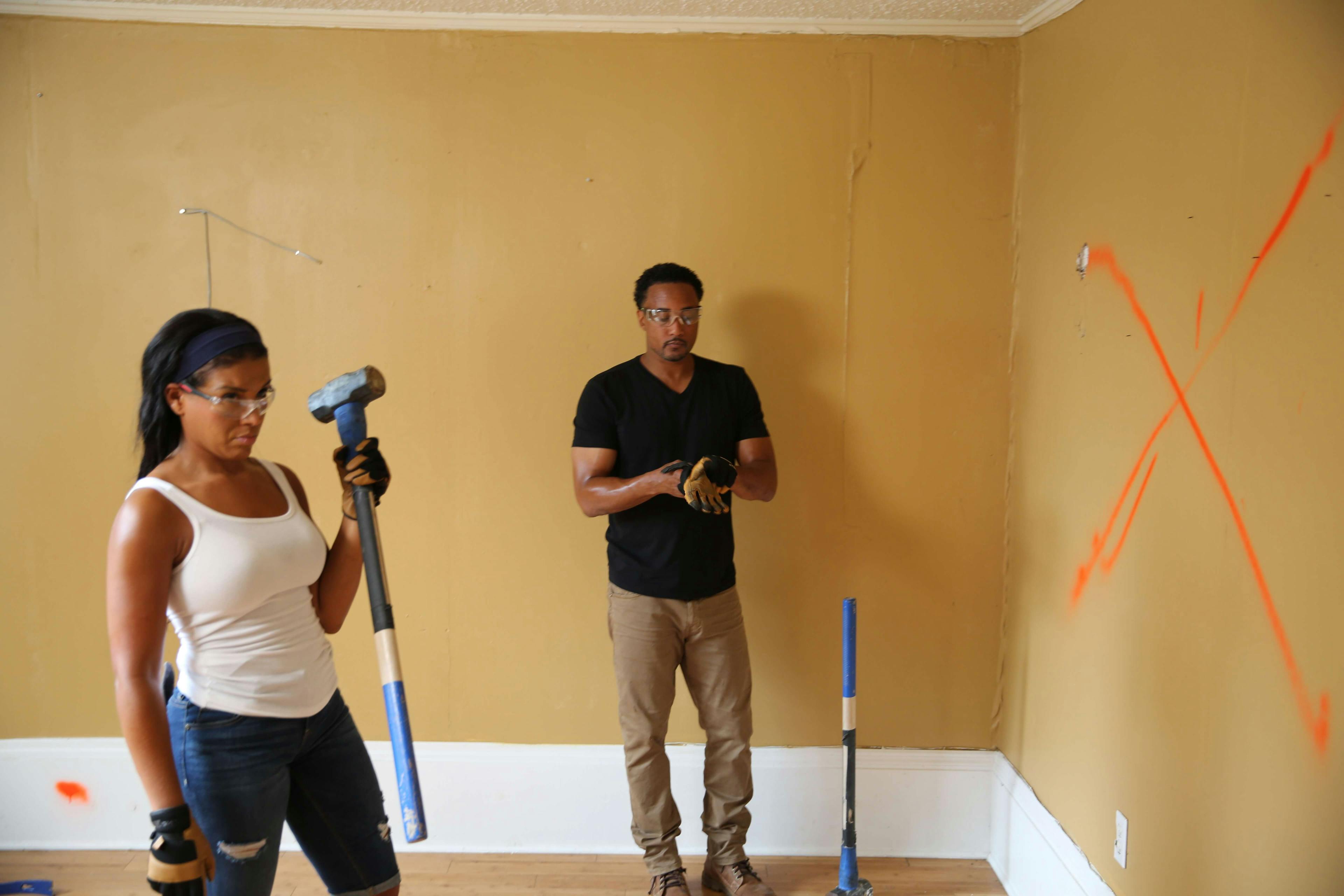 Couple decorating walls