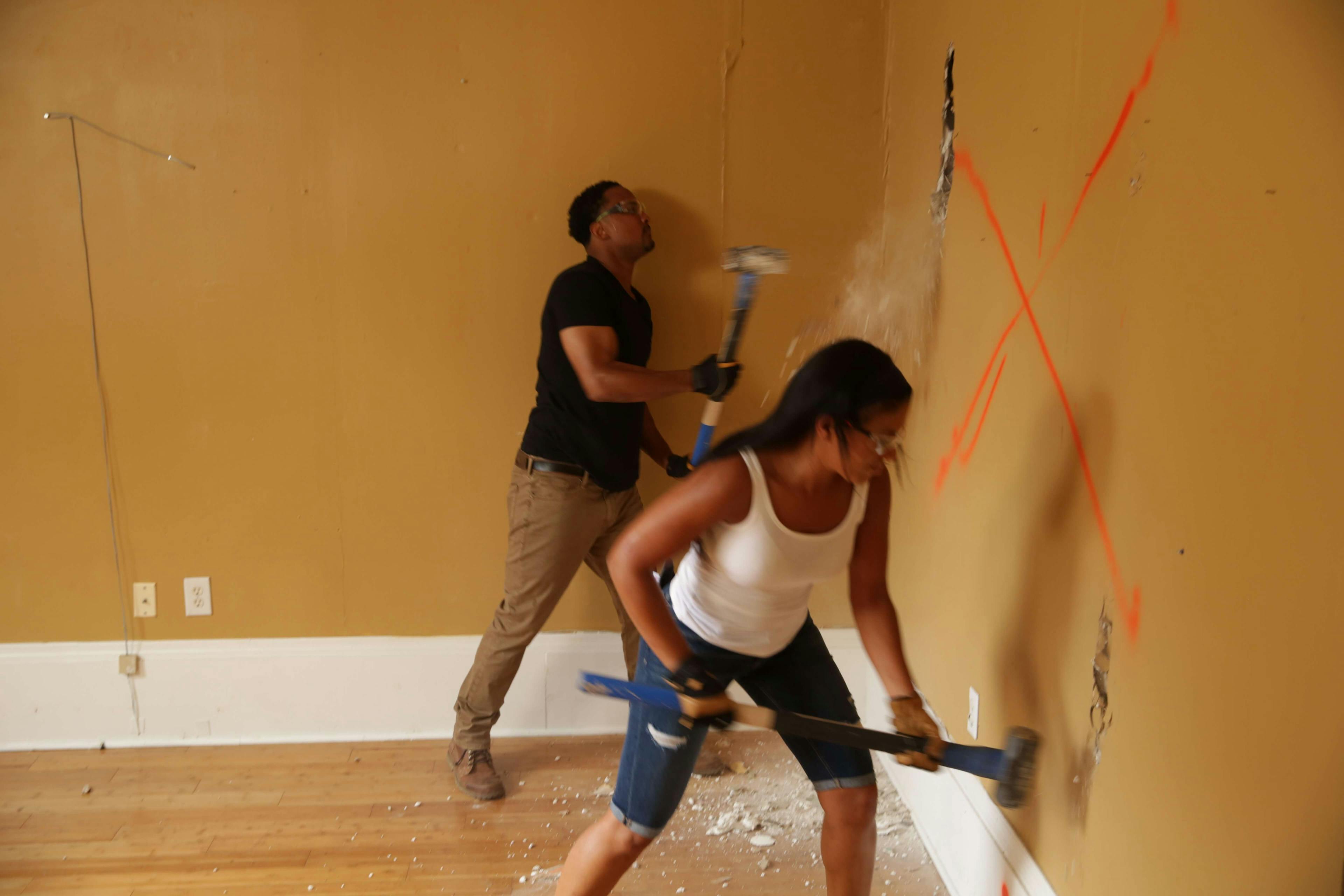 Couple decorating walls