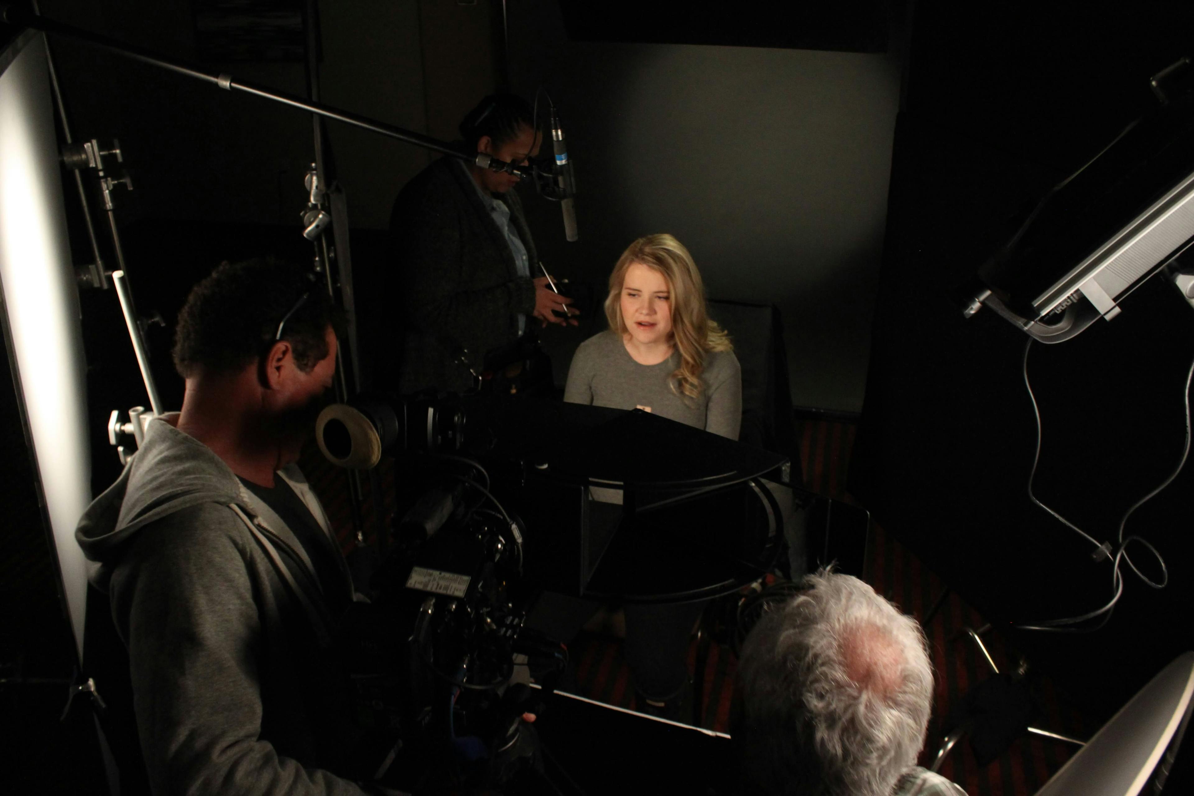 BTS shot of woman being interviewed