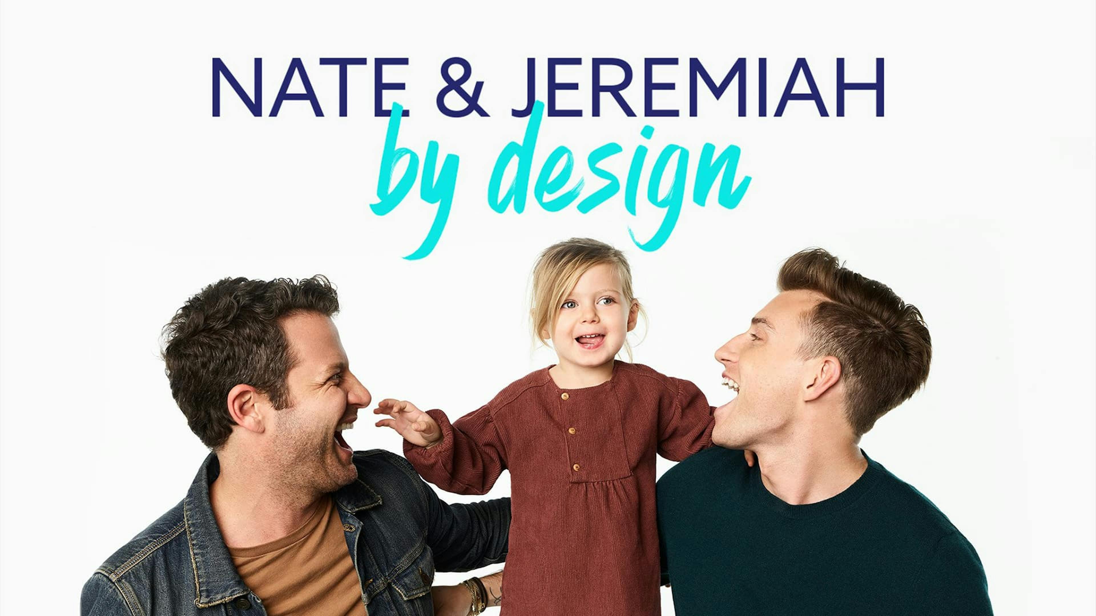 Two men laughing with little girl sat between them