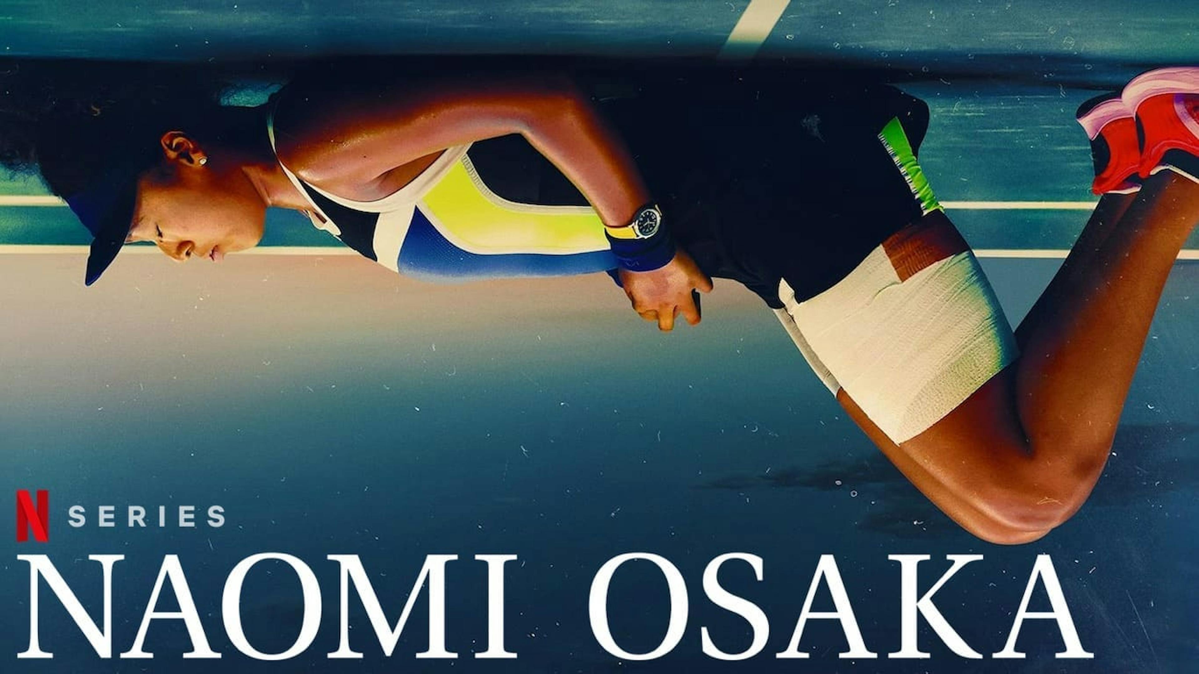 Upside down view of girl laying on tennis pitch