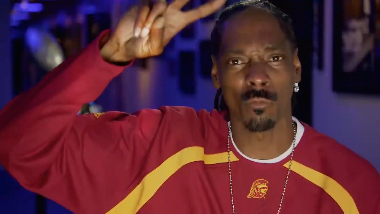 Man doing the peace symbol at camera