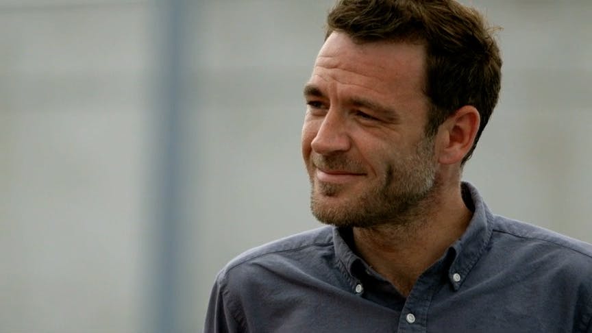 Man looking to the side smiling