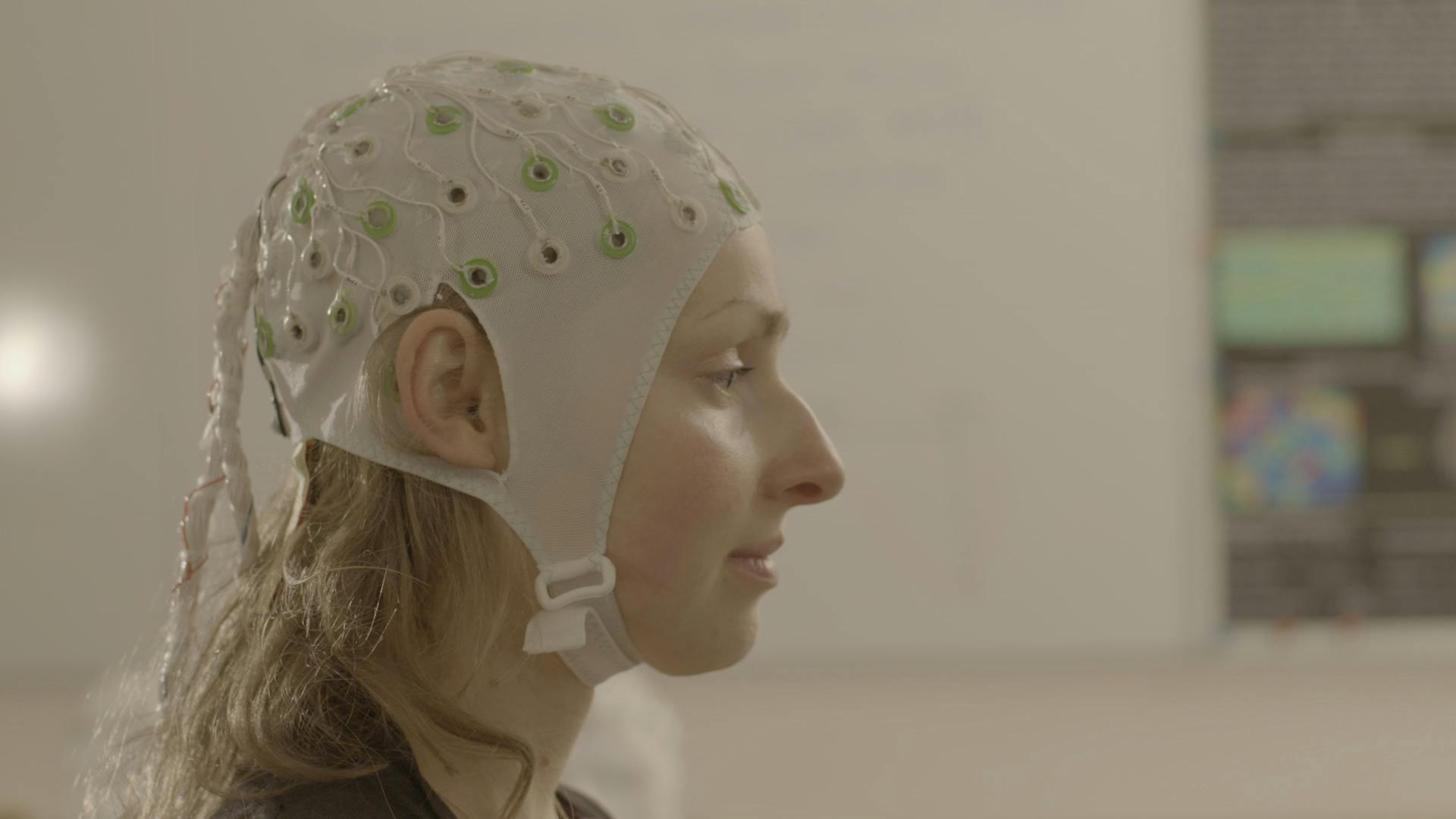 Woman wearing ECG cap