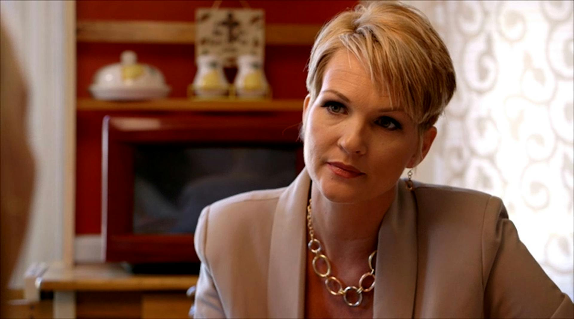 Woman looking at another woman