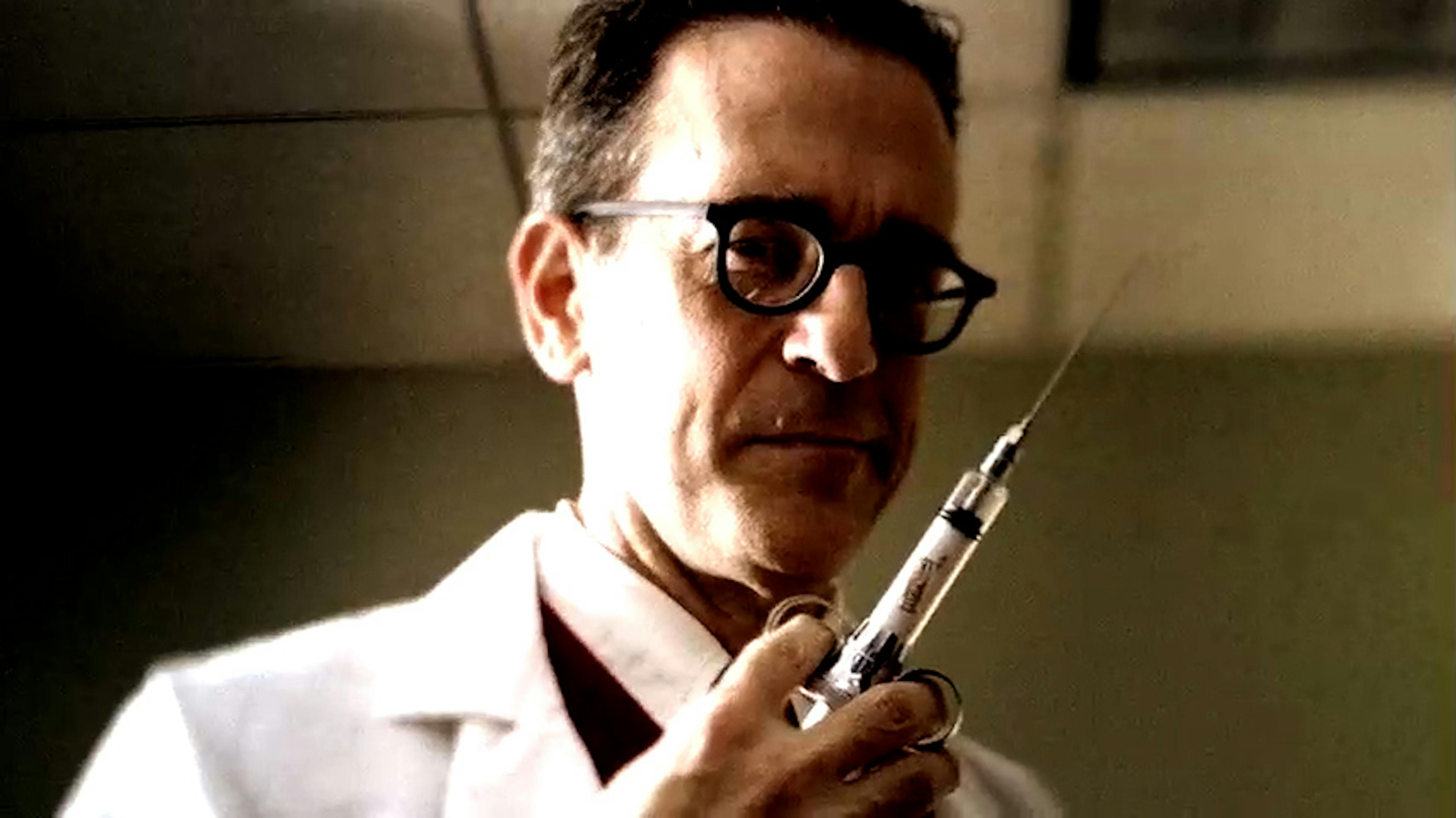 Dr holding needle