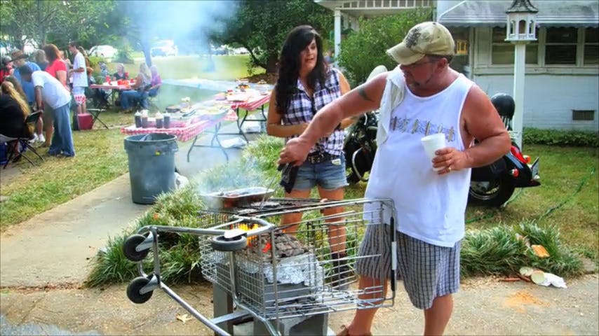 Two people BBQing