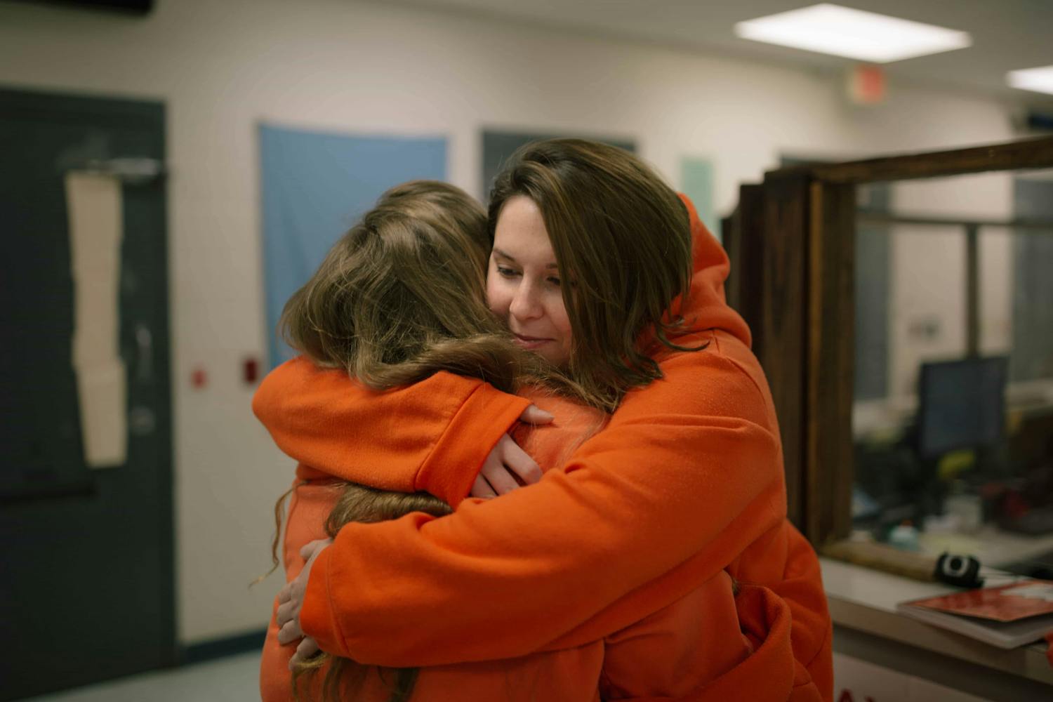 Two female prisoners hugging