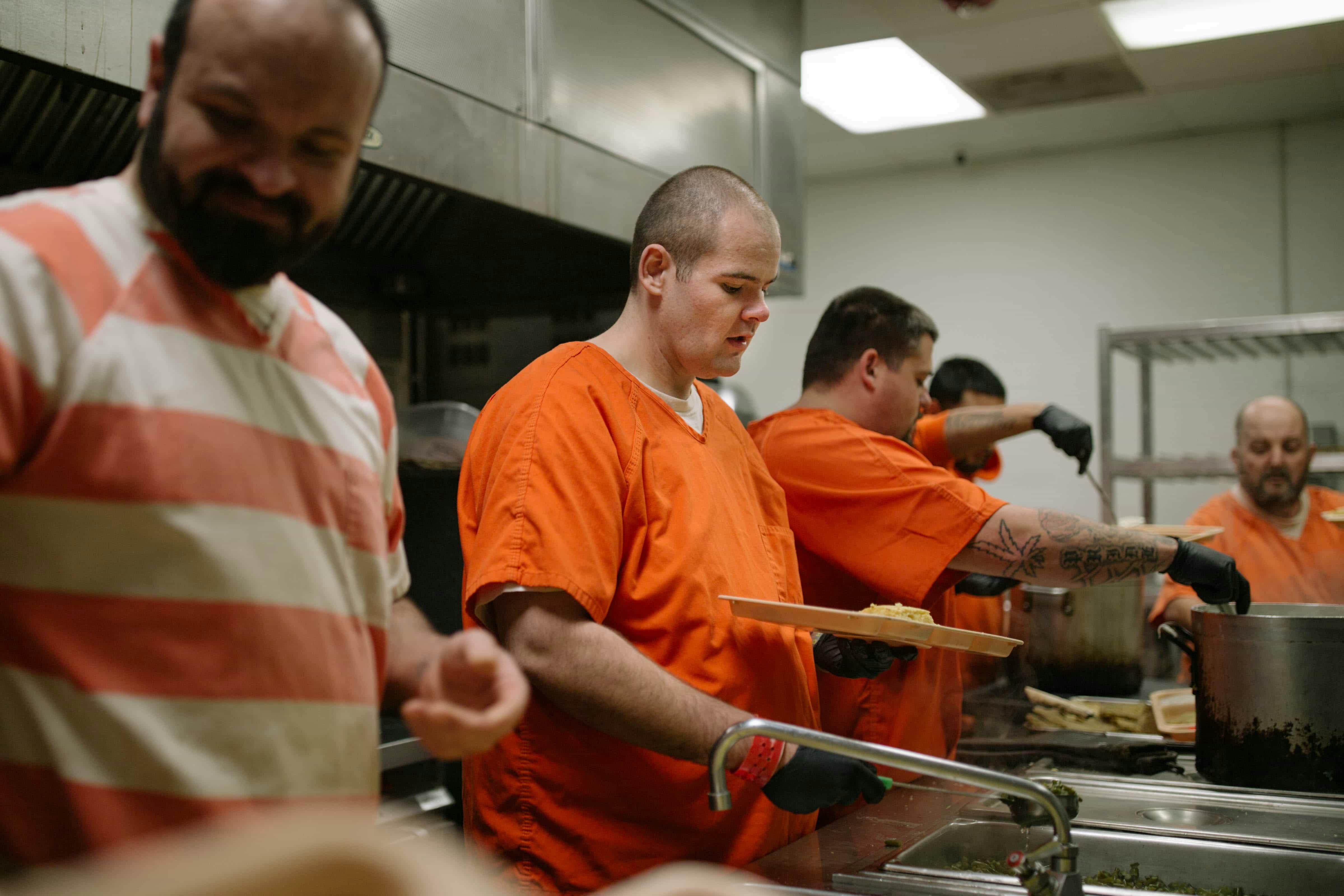 Male prisoners serving food