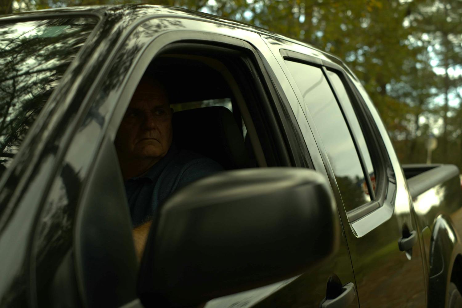 Man looking out of car window