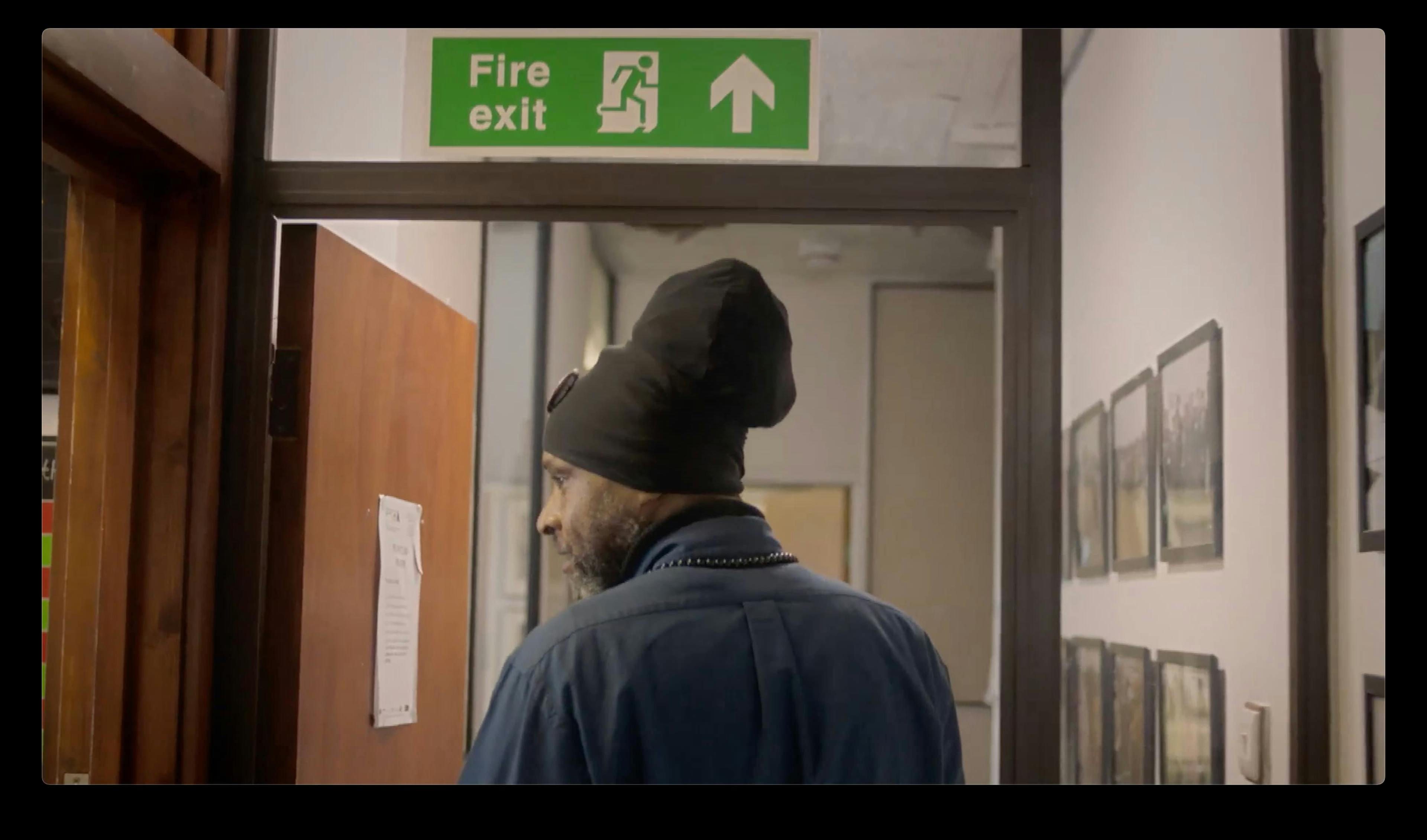 Man walking in corridor