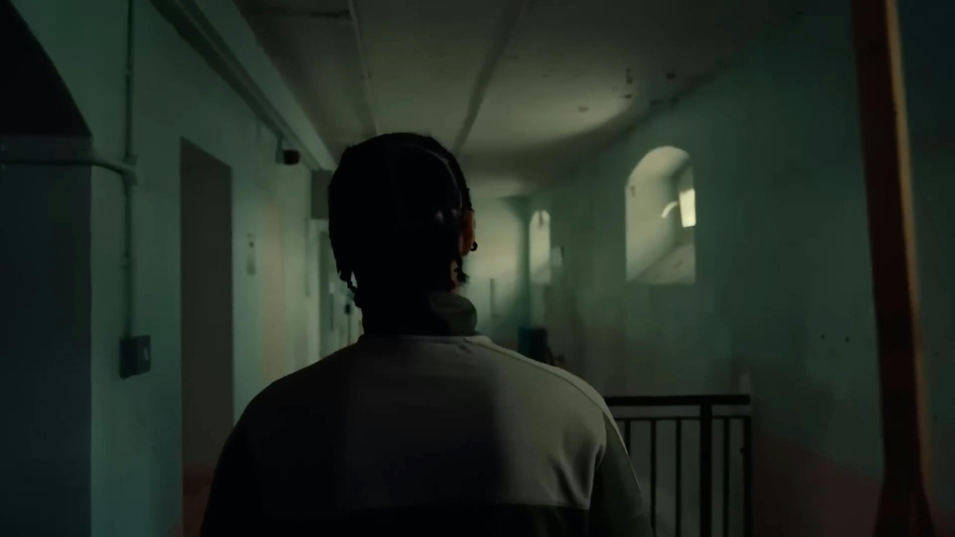 Man walking through prison