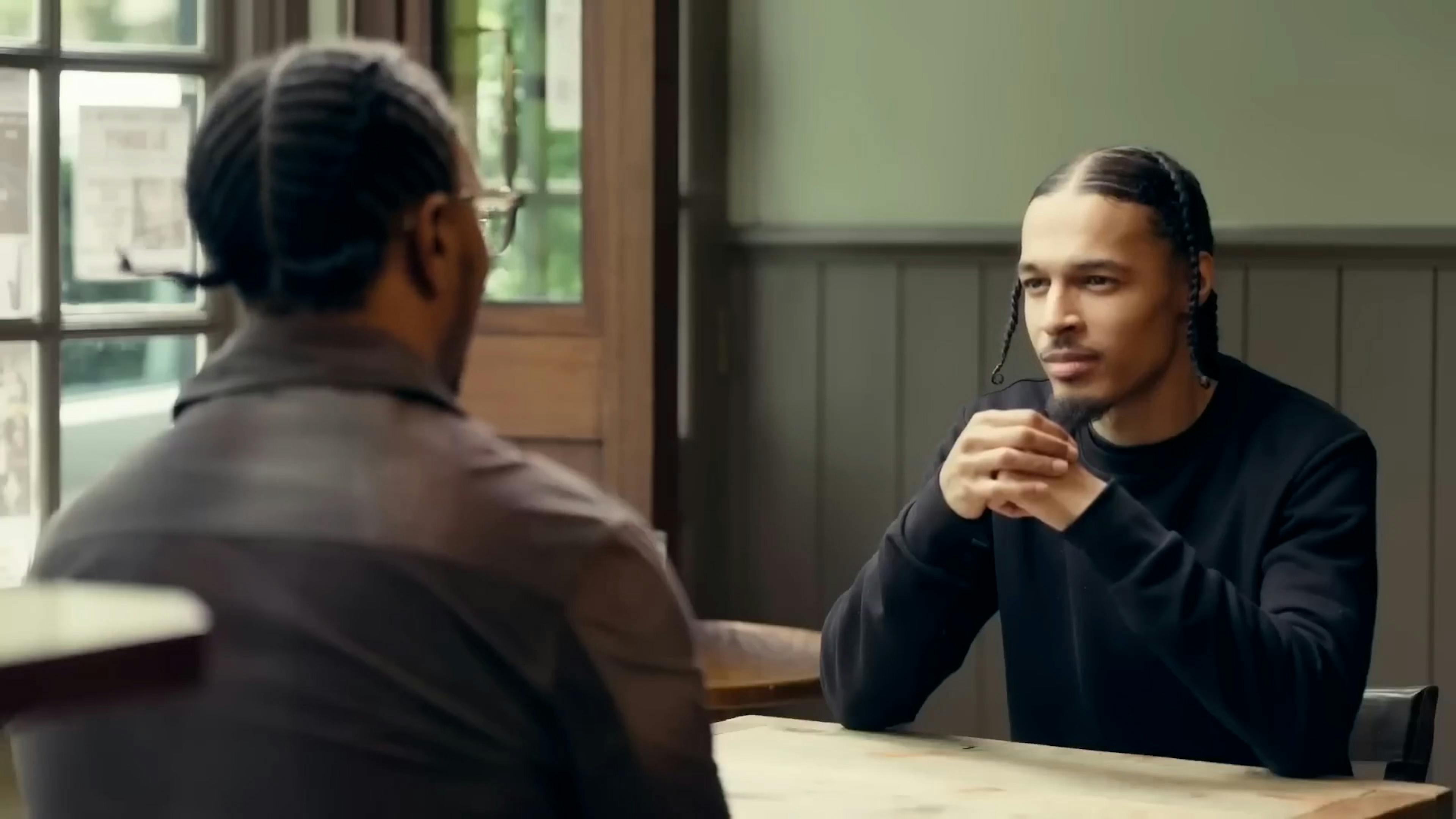 Two men talking at table